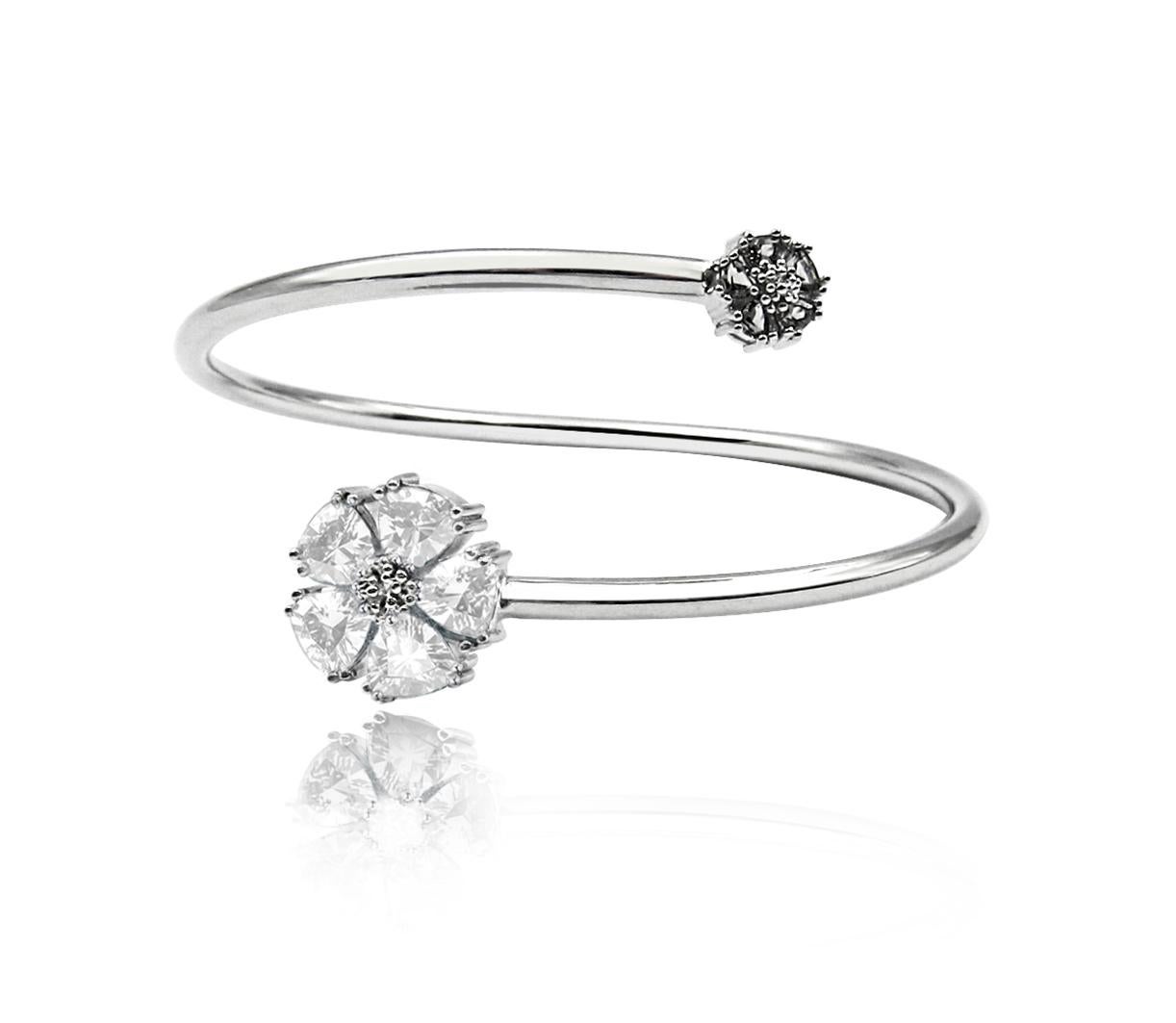 Whatever the season, take a little natural beauty with you everywhere you go. This stunningly simple, yet beautiful blossom gentile bypass bangle is your perfect complement to any style. .925 sterling silver base. Also available in 24k yellow or