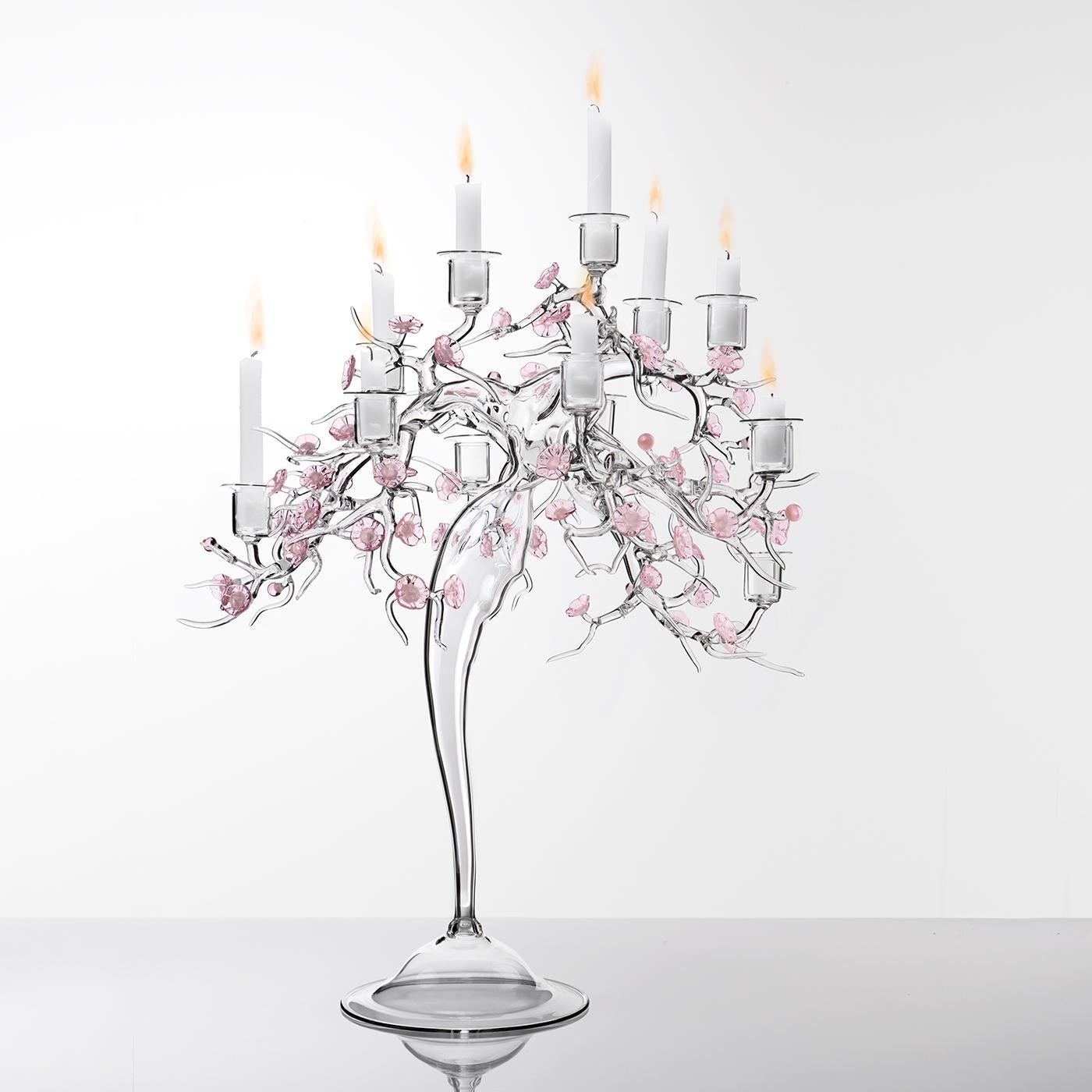 The Blossom Candelabra is a striking decorative piece that reimagines the traditional candelabra through its innovative design. Formed from a tangle of branches and adorned with delicate floral details, it captures the essence of a flourishing