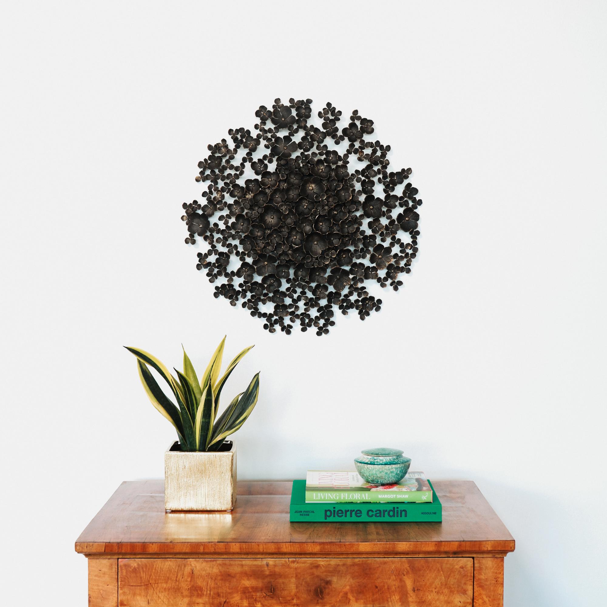 The Blossom Wall Sculpture features inexhaustible blooms, each cut, forged and cupped one at a time. It’s our technique for creating incredible depth and a sense of calm. The depth achieved through the intricate cupping of each blossom adds a