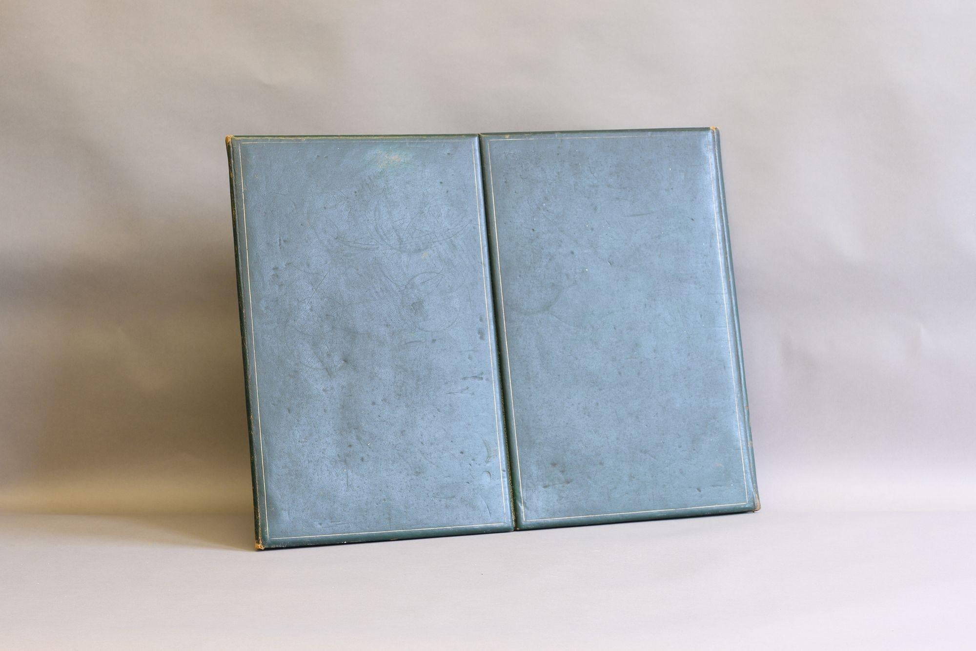 Folding leather bound blotter. Circa 1930
H 46cm x W 60/121cm x D 2cm