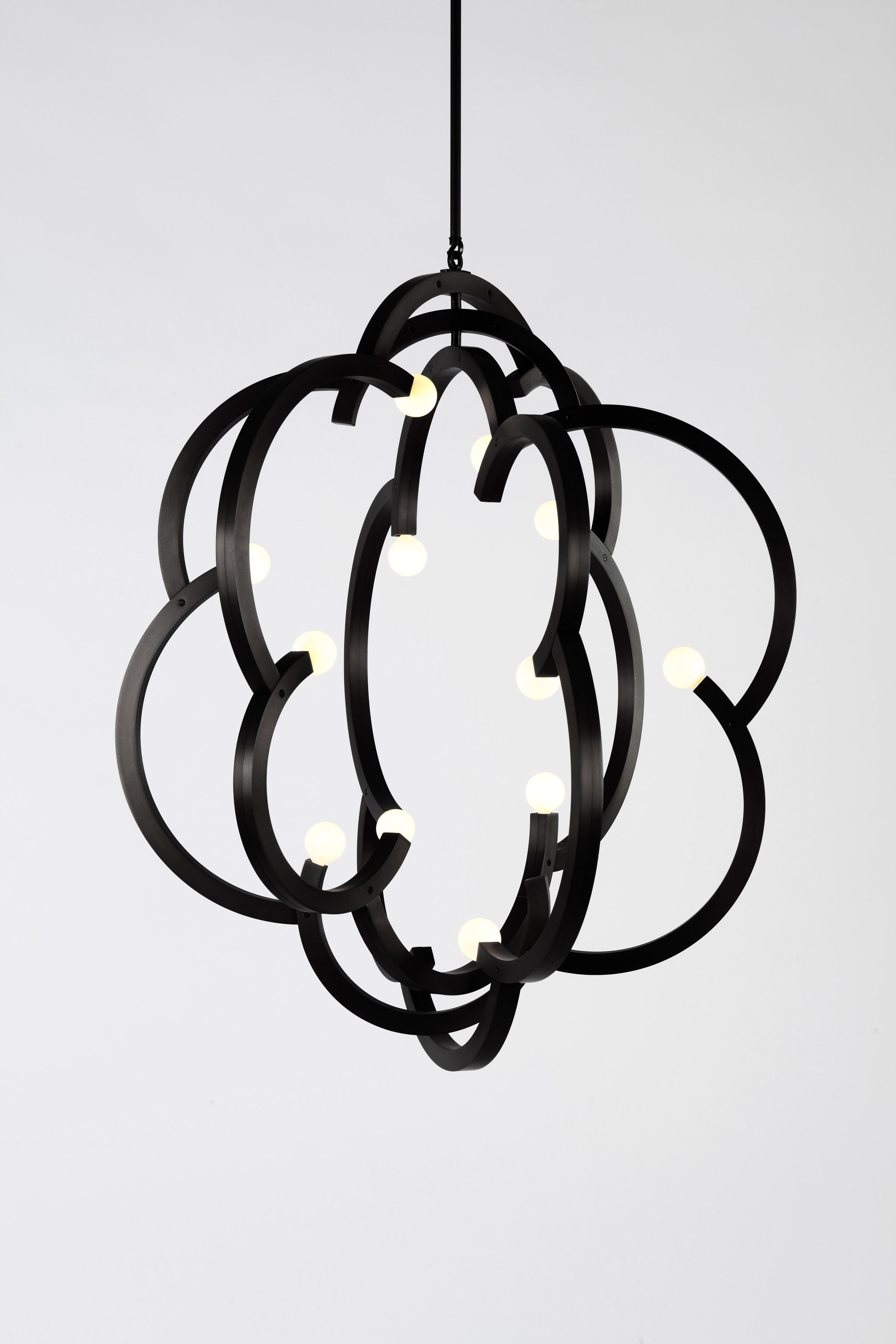 Blow is inspired by traditional French wine barrel candelabras, where the wooden staves are typically inverted and mounted to the metal hoops. These staves are playfully scaled and oriented to create an asymmetrical metal cloud-like form