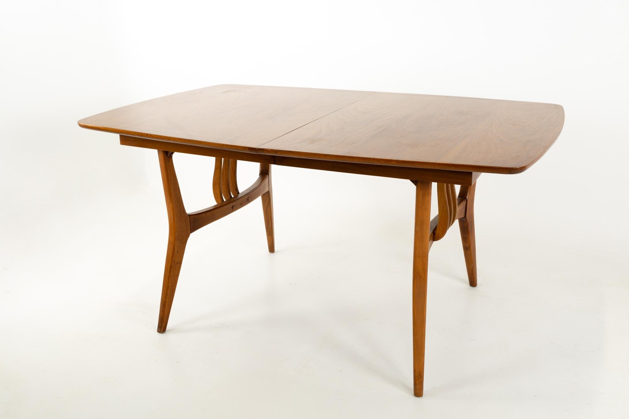 Blowing rock mid century 10 person walnut surfboard dining table
This table is 60 wide x 39.5 deep x 29.5 inches high, and each of the leaves is 12 inches wide, making the table a total of 96 inches wide with the 3 leaves installed

Each piece of
