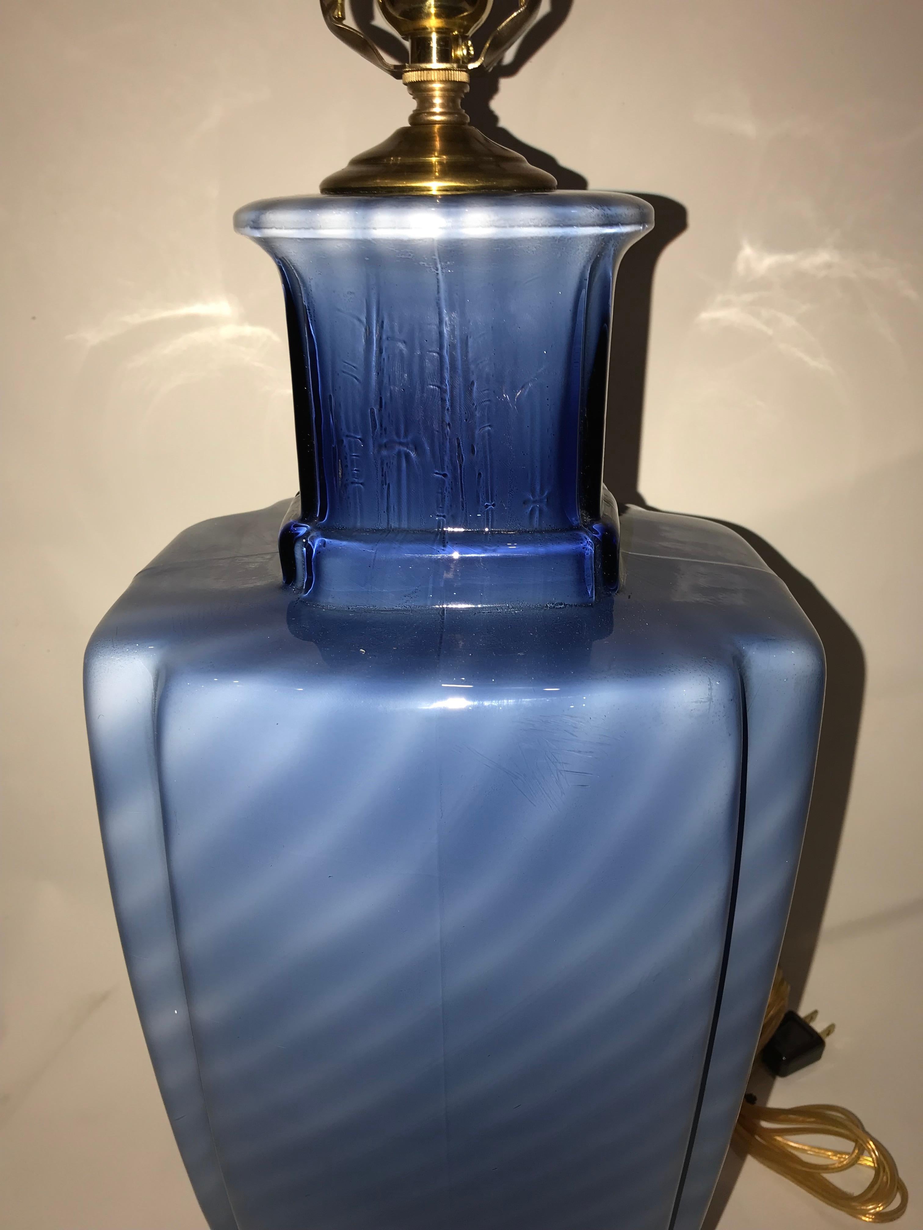 A blue Murano glass table lamp with bronze base, circa 1950s.

Measurements:
Height of body 19