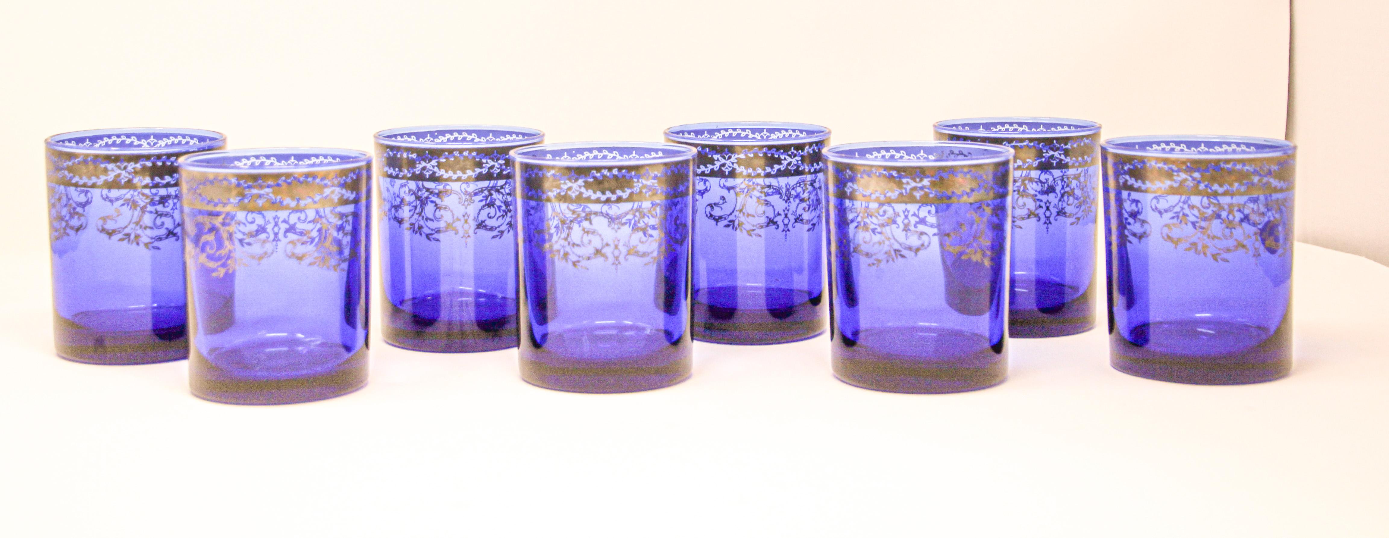 Set of eight whiskey glasses tumbler in cobalt blue blown gilt crystal.
The vibrant hand blown rich sapphire blue jewel sapphire blue blown crystal glass with hand decorated gold overlay design.
Set of eight rock whiskey or water barware, drinking