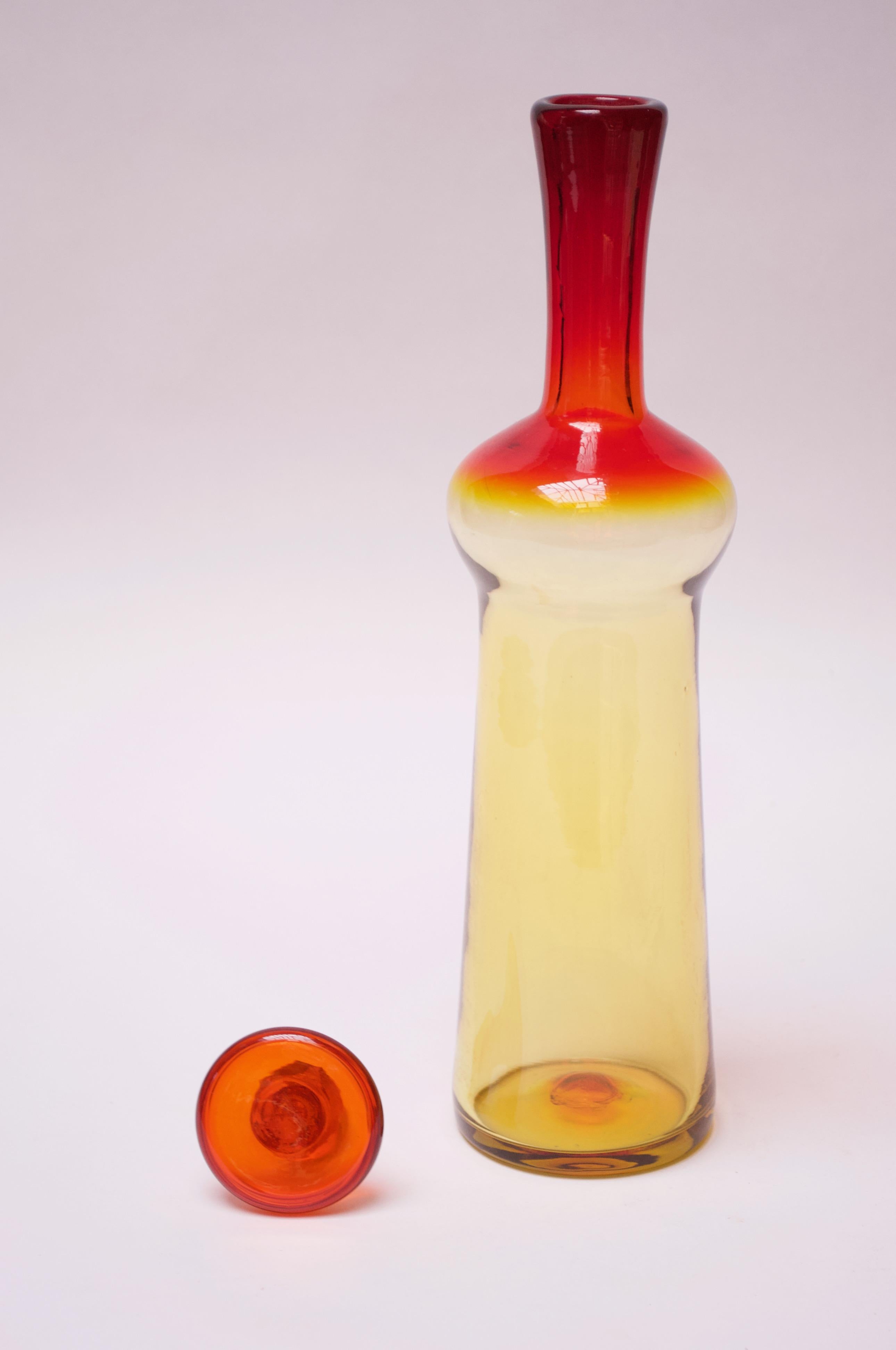 Blown glass decanter with original button stopper designed in the 1960s by Wayne Husted for Blenko as part of the 