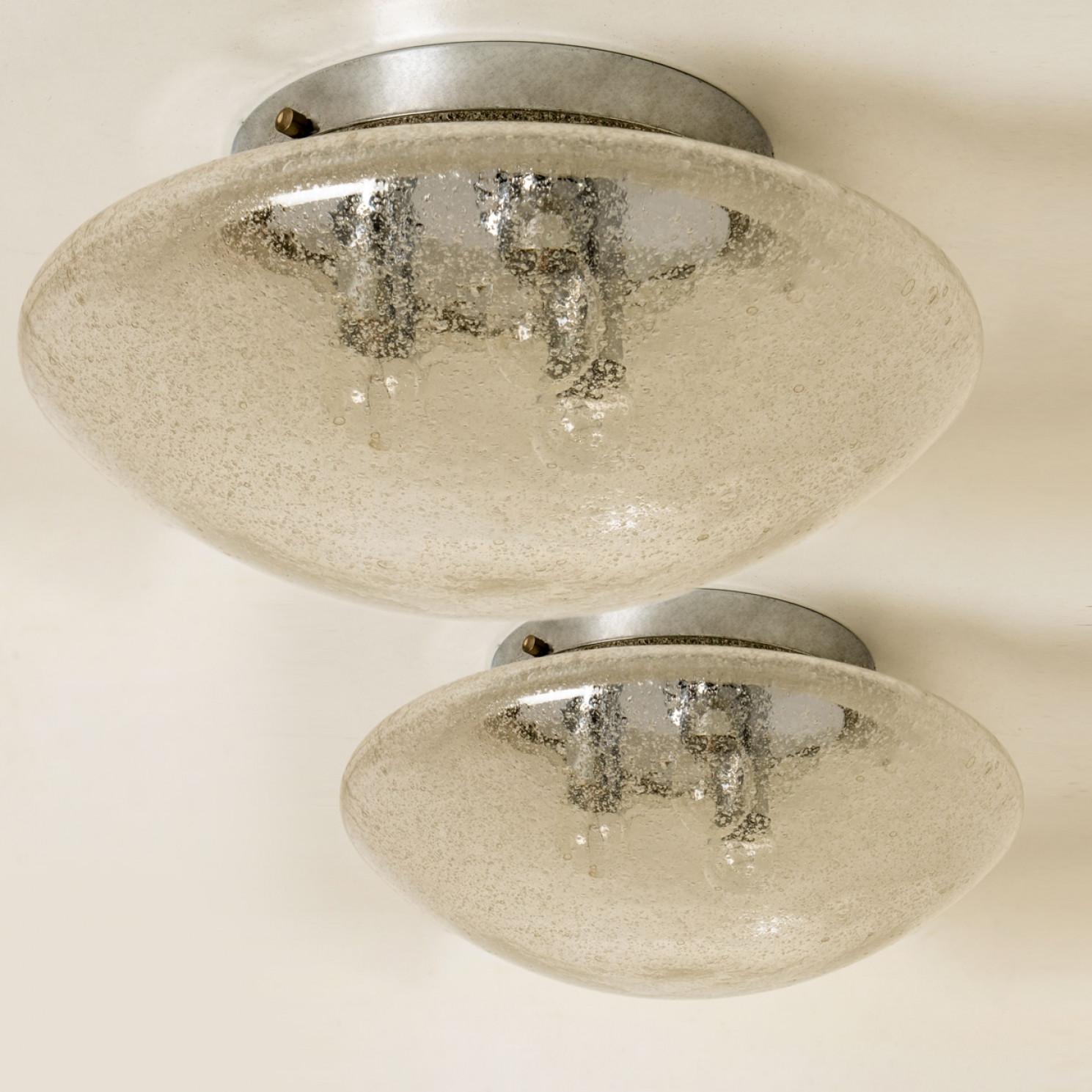 Clean lines to complement all decors. Wonderful high-end Hillebrand flush mounts with chrome detail and thick textured blown glass, filling a room with a soft, warm glow. The chrome back plate holds three E14 sockets.

Can also work for impressive