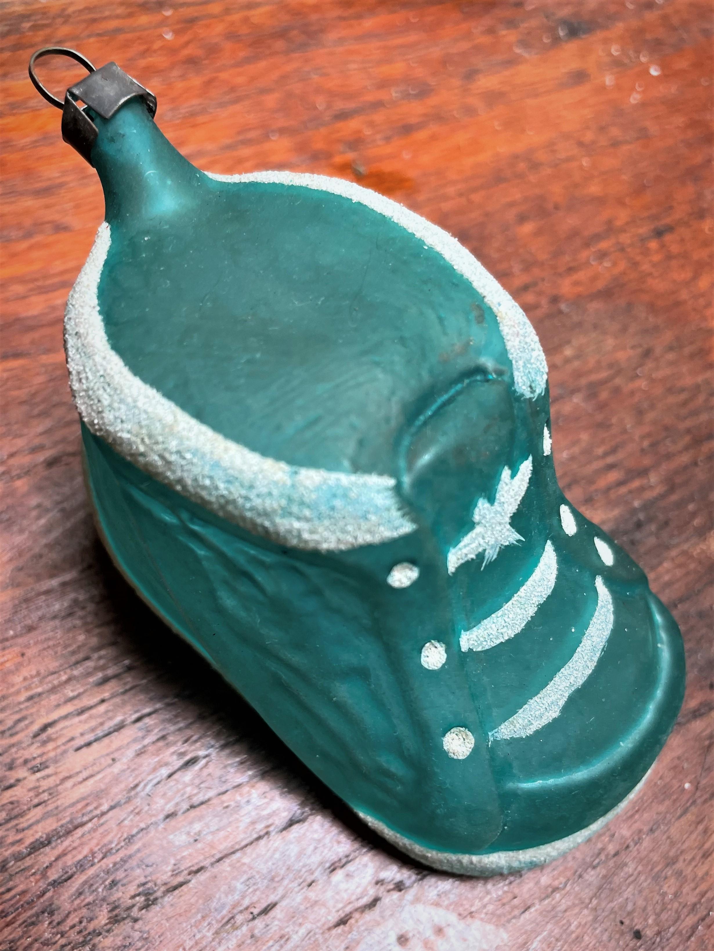 This little blown glass Christmas ornament baby boot is as sweet as can be! It is in good condition and would make a fabulous gift for a baby's first Christmas or would work if you are doing a blue Christmas this year. It is a lovely baby blue color