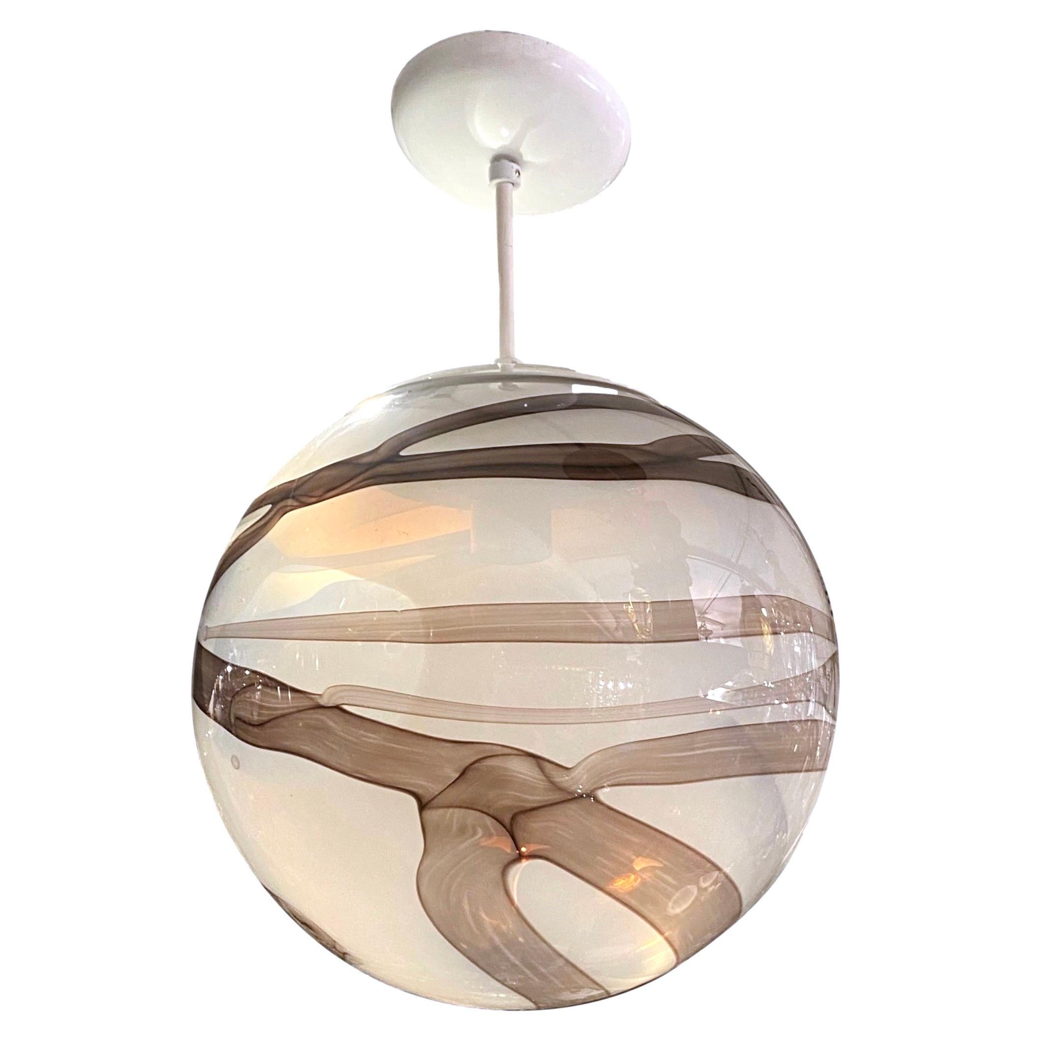 A vintage Italian circa 1960’s blown glass globe lantern.

Measurements:
Drop: 16