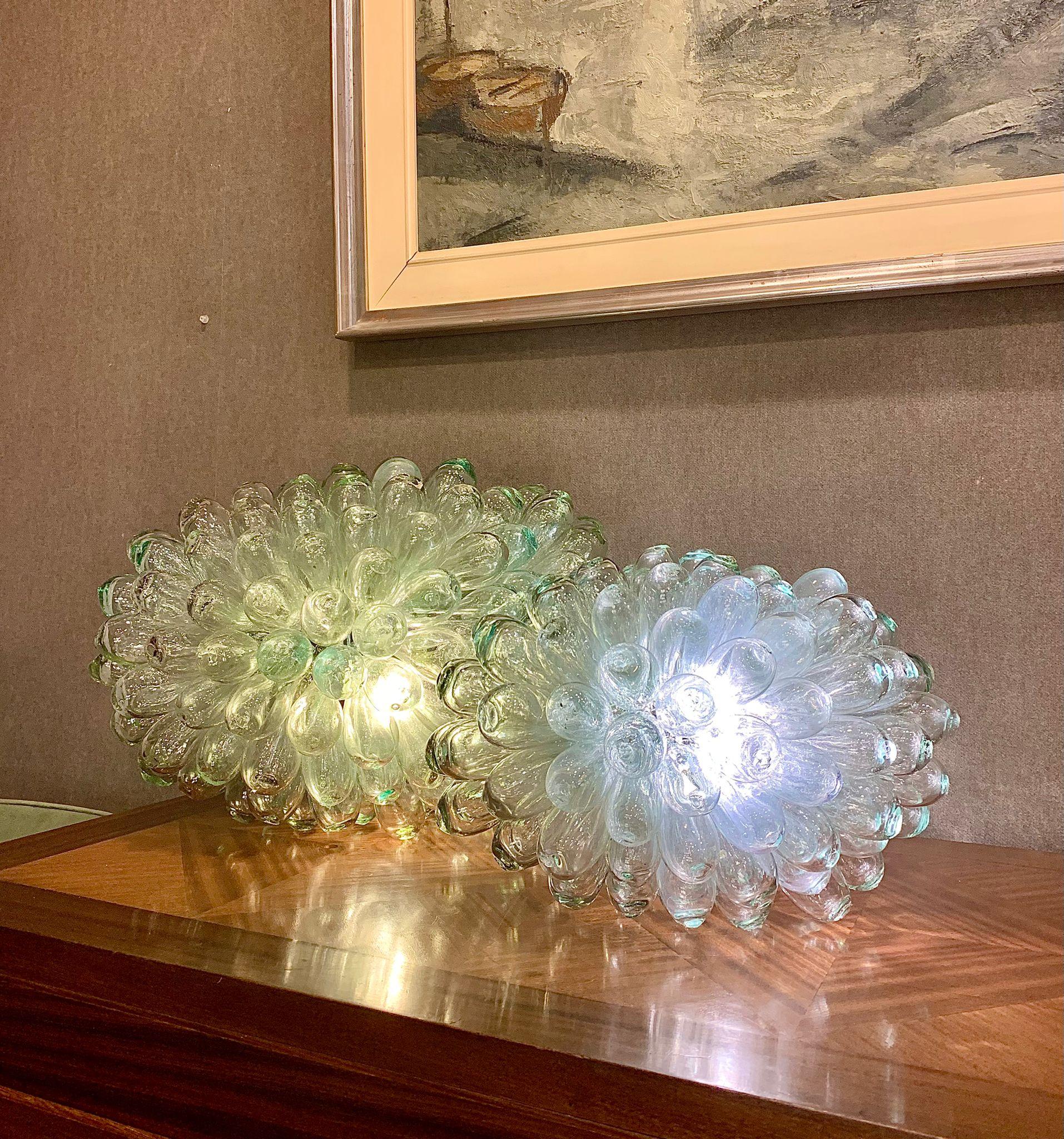 Amazing and one of a kind Baladi lamp made by Syrian master craftsmen with recycled glass. Broken, damaged or abandoned bottles are recovered, then crushed and passed through a sieve to obtain a powder that is then melted at a very high