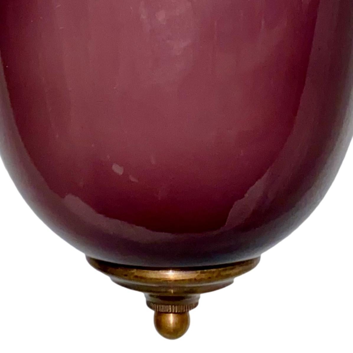 A Italian blown amethyst glass pendant light fixture with two interior lights, circa 1950s.

Measurements:
Diameter: 8.75