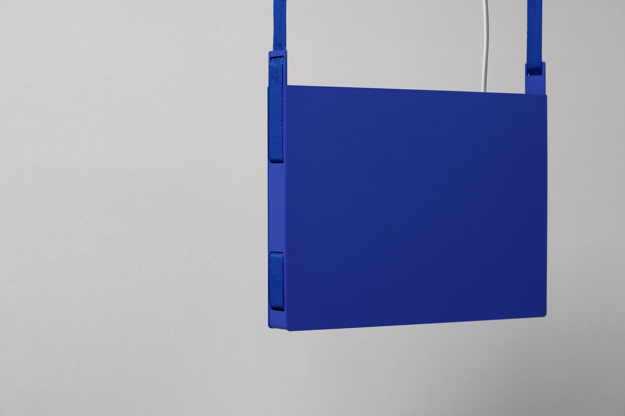 BLT_2 Ultra Blue Pendant Lamp by +kouple
Dimensions: D 33 x W 3,4 x H 27,7 cm. 
Materials: Powder-coated steel, aluminum and plastic.

Available in different color options. The rod length is 250 cm. Please contact us.

All our lamps can be wired