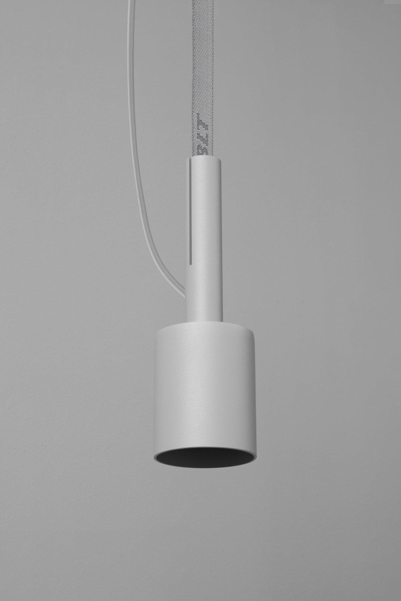 BLT_5 Grey Pendant Lamp by +kouple
Dimensions: Ø 8 x H 25,2 cm. 
Materials: Powder-coated steel and textile.

Available in different color options. The rod length is 250 cm. Please contact us.

All our lamps can be wired according to each country.