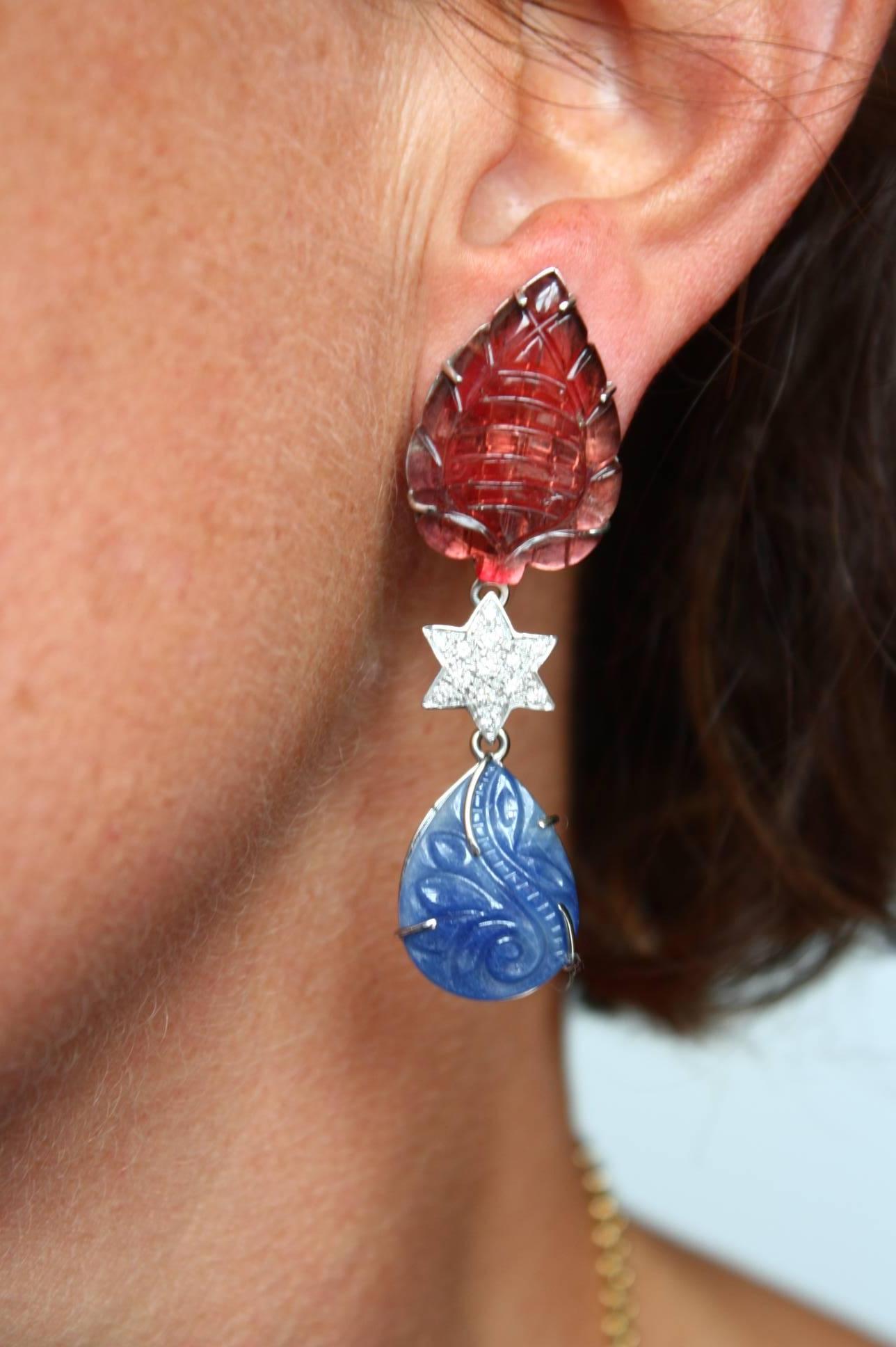 Carved drops pink tourmaline and sapphire with a star in diamonds Cts 1,10 to connect the 2 elements. White gold 12gr total length 5,5 cm weight 8,9 gr. each.
All Giulia Colussi jewelry is new and has never been previously owned or worn. Each item