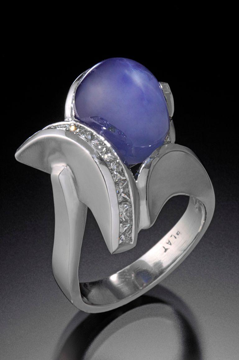 Let me introduce myself to this one-of-a-kind melding of art and nature. In the early 1980’s. As a gemologist and designer craftsman, I cast a net to the nation’s gem dealers, searching for an extraordinary, rich blue, large, star sapphire cabochon