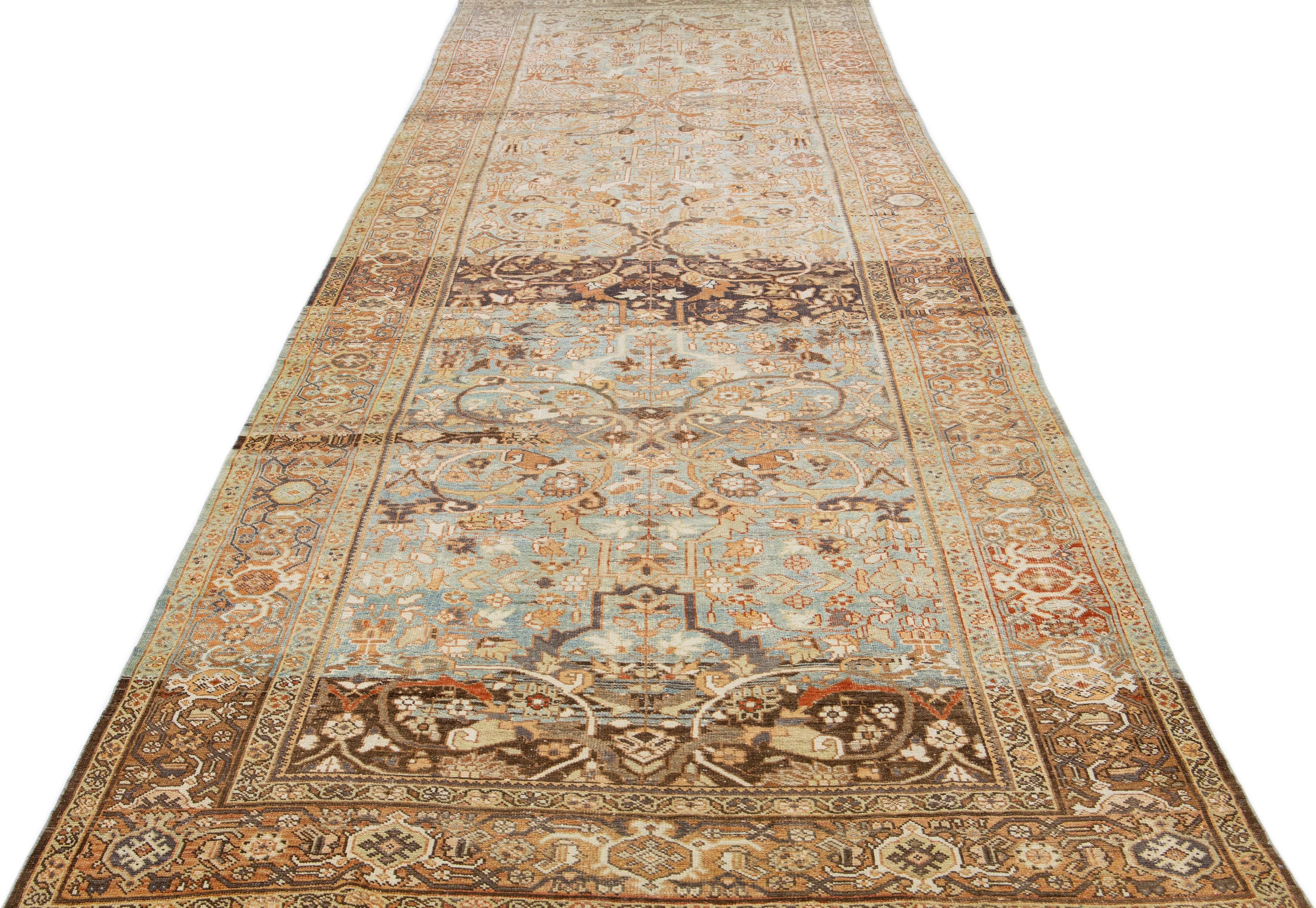 This 1930s mahal gallery wool rug boasts a blue main field, highlighted by rust, beige, and brown in an all-over floral pattern, creating a classic look.

This rug measures: 6'4