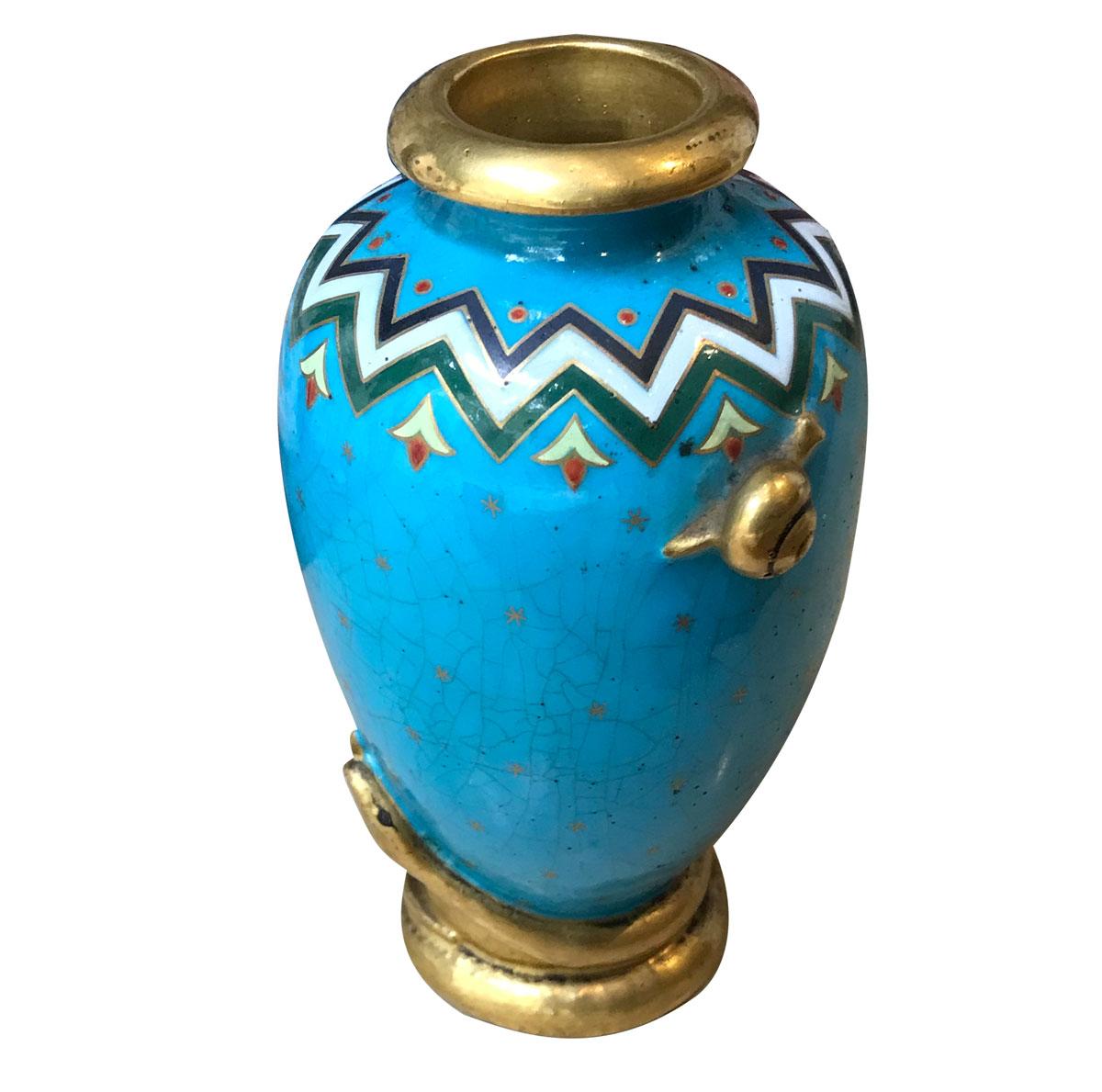 Elegant and refined small Japanese-style porcelain vase. Aesthetic Movement piece with a blue background and colorful geometric patterns typical of Christopher Dresser's designs enhanced with small stars all over the vase.
It is decorated with two