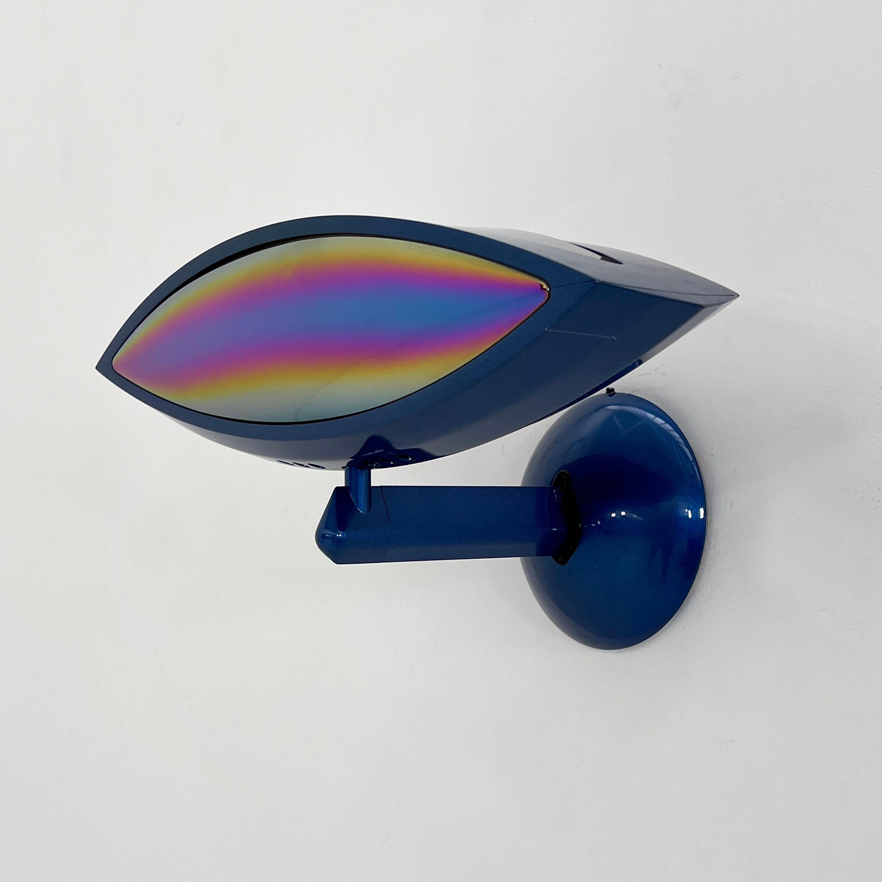 Blue Aeto Wall Lamp by Fabio Lombardo for Flos, 1980s

2 pieces available - Price is per piece 
Designer - Fabio Lombardo
Producer - Flos
Model - Aeto Wall Lamp
Design Period - Eighties
Measurements - Width 45 cm x Depth 25 cm x Height 20