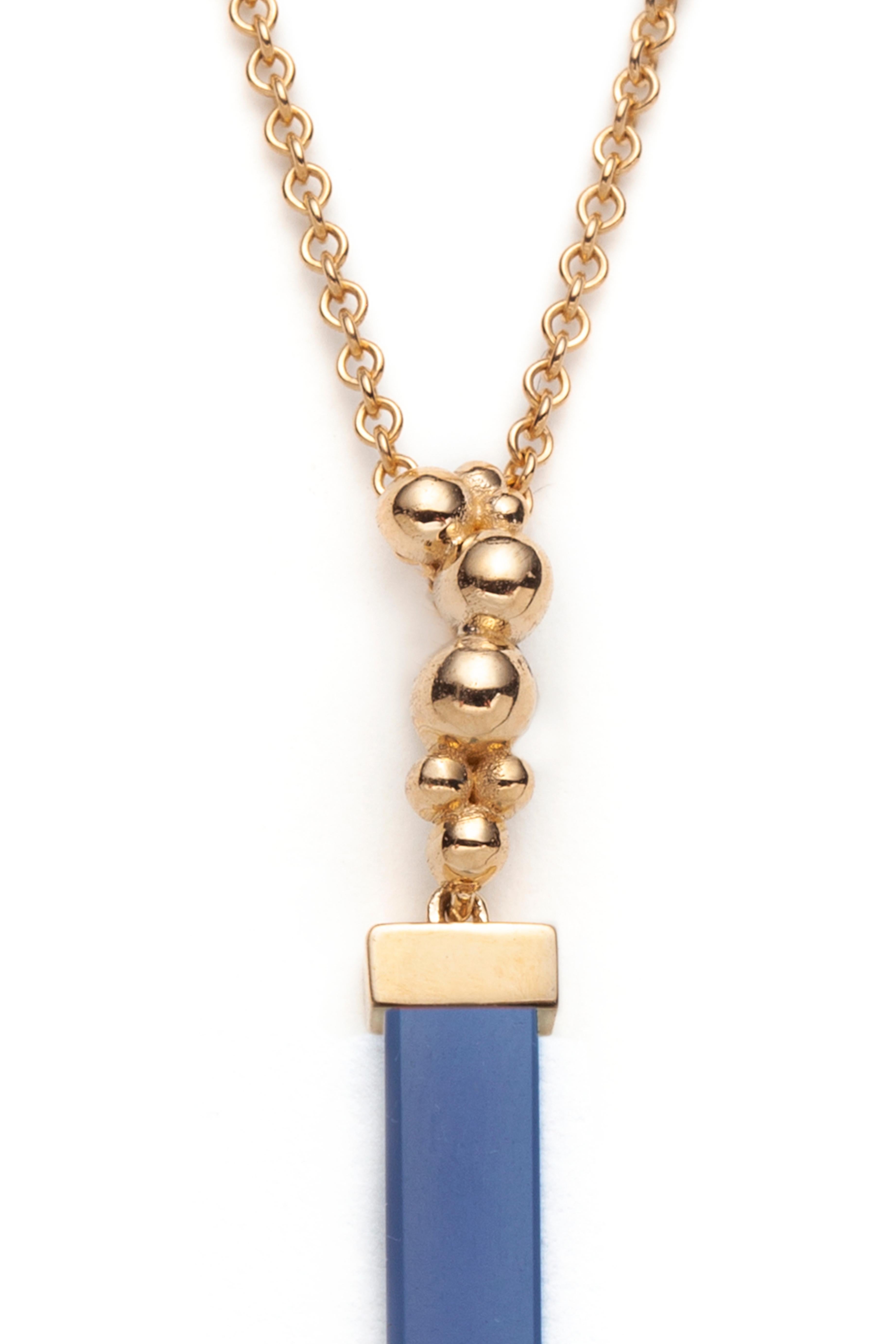 We make this colorful pendant in 14k yellow gold set with a rectangular Coral batons and a citrine teardrop. The pendant length is 42mm. The 18