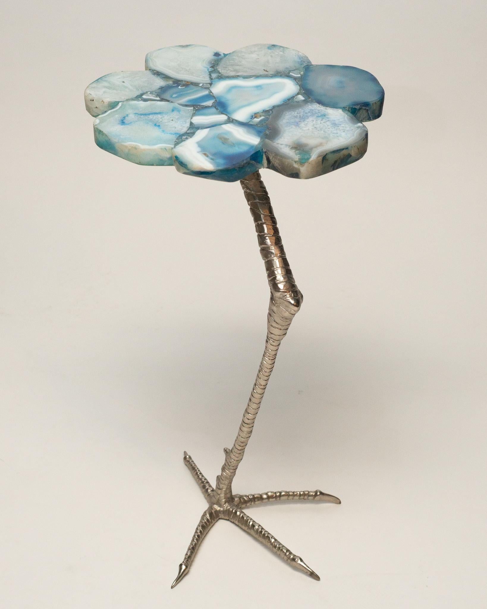 A stunning blue agate drink table with a chrome ostrich leg. The vibrant stones add an element of bright, bold colour to any room. Agates, named for the Achates river in Sicily, are known for being some of the most colorful semi-precious stones