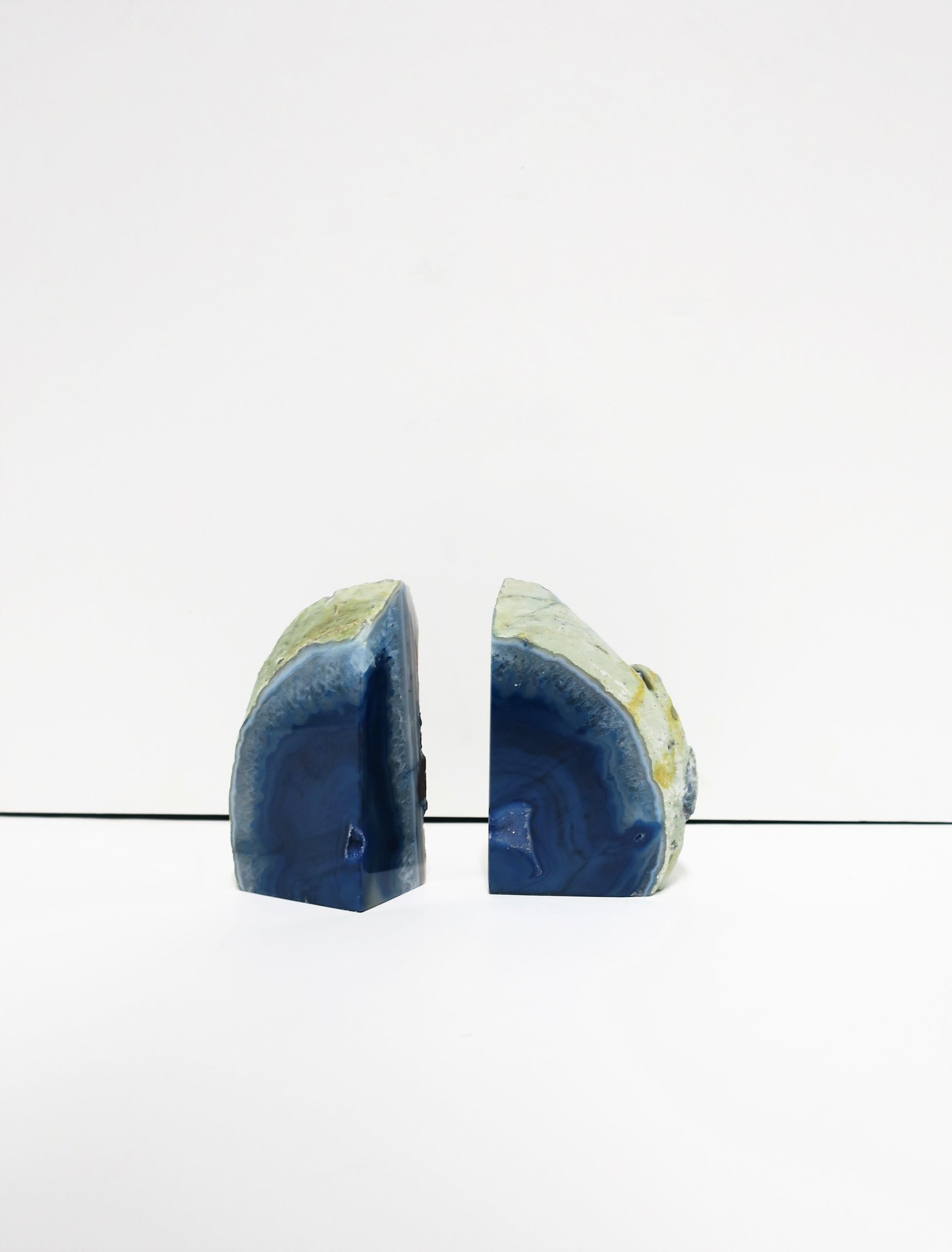 A beautiful pair of cobalt blue natural agate bookends or decorative objects, circa 20th century, Brazil. These agate bookends may work well on a bookshelf or equally well as standalone decorative objects together or separate (as shown.) Each