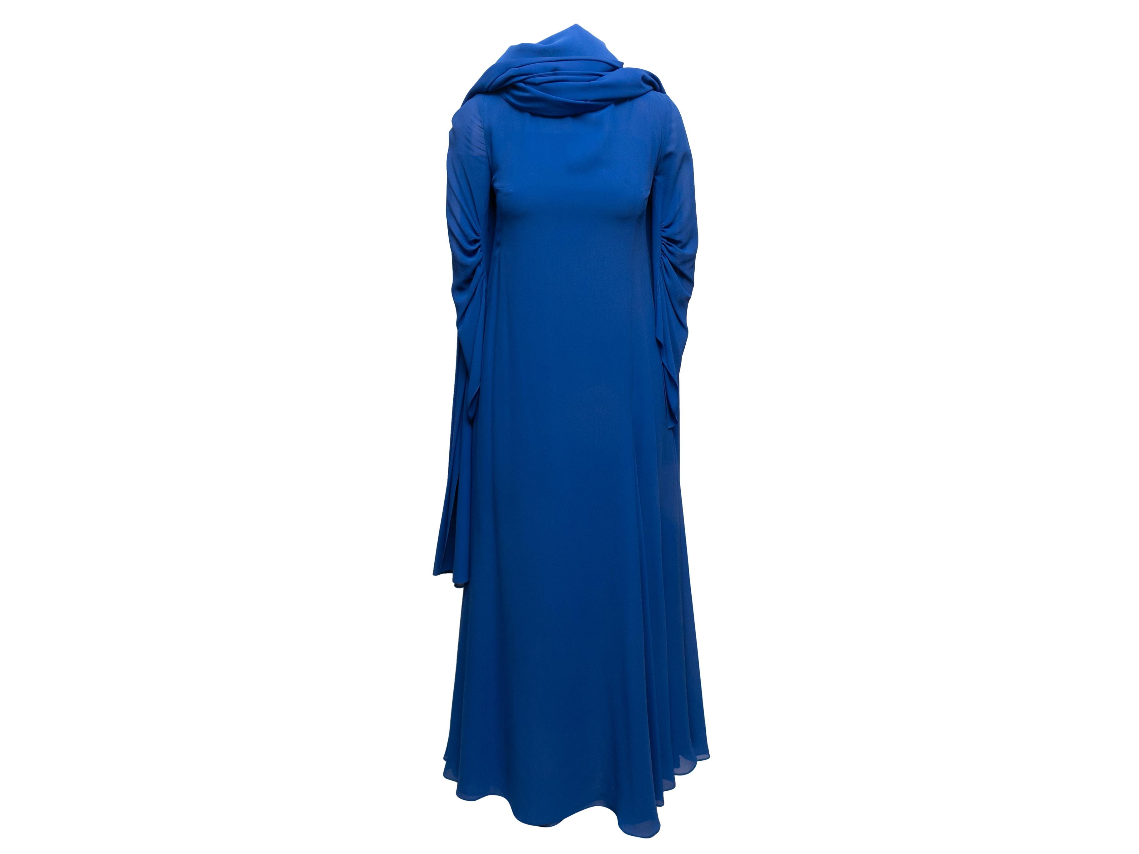 Blue long sleeve silk gown by Akris. Scarf accent at neck. Closure at back. 30