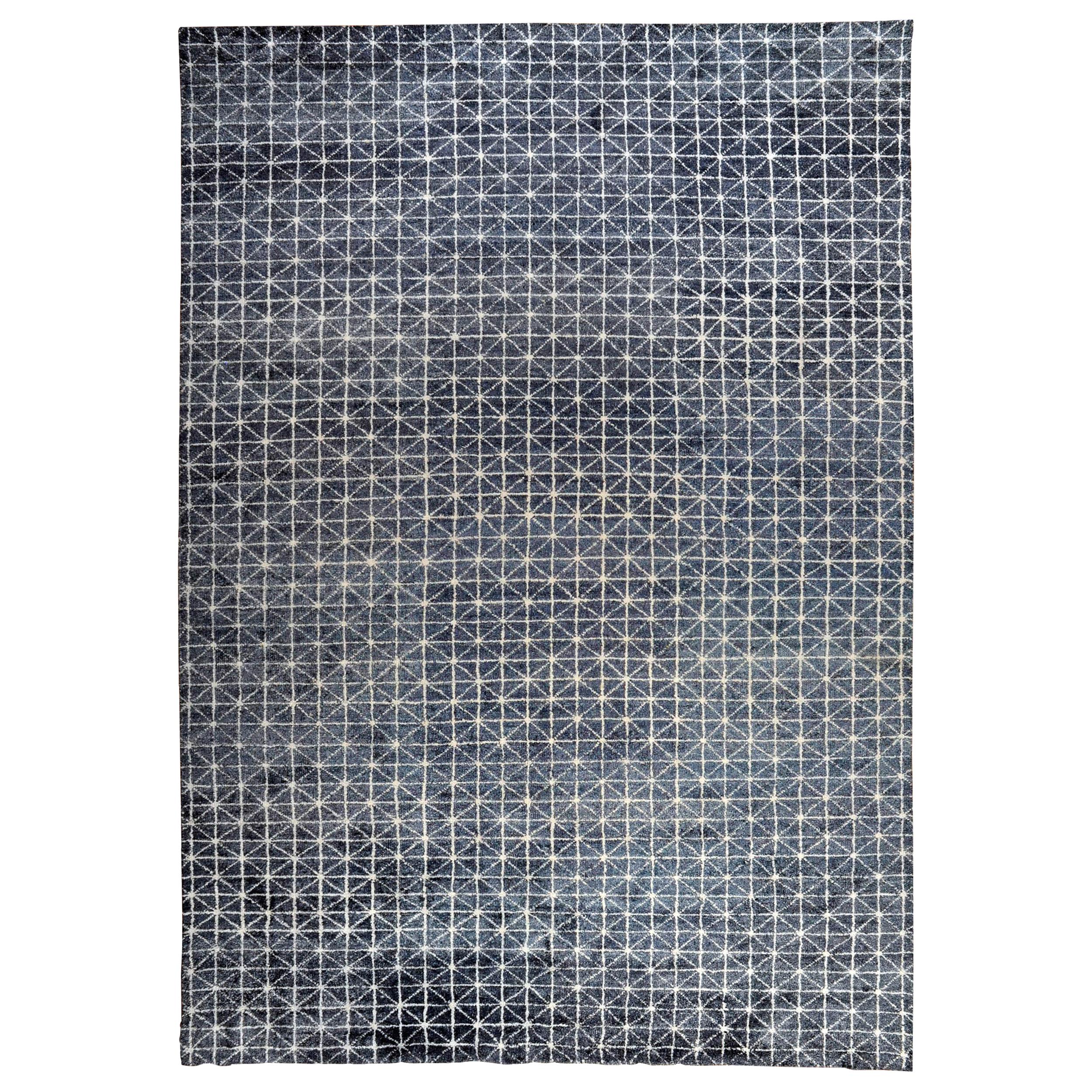 Tapis contemporain bleu à motifs multiples