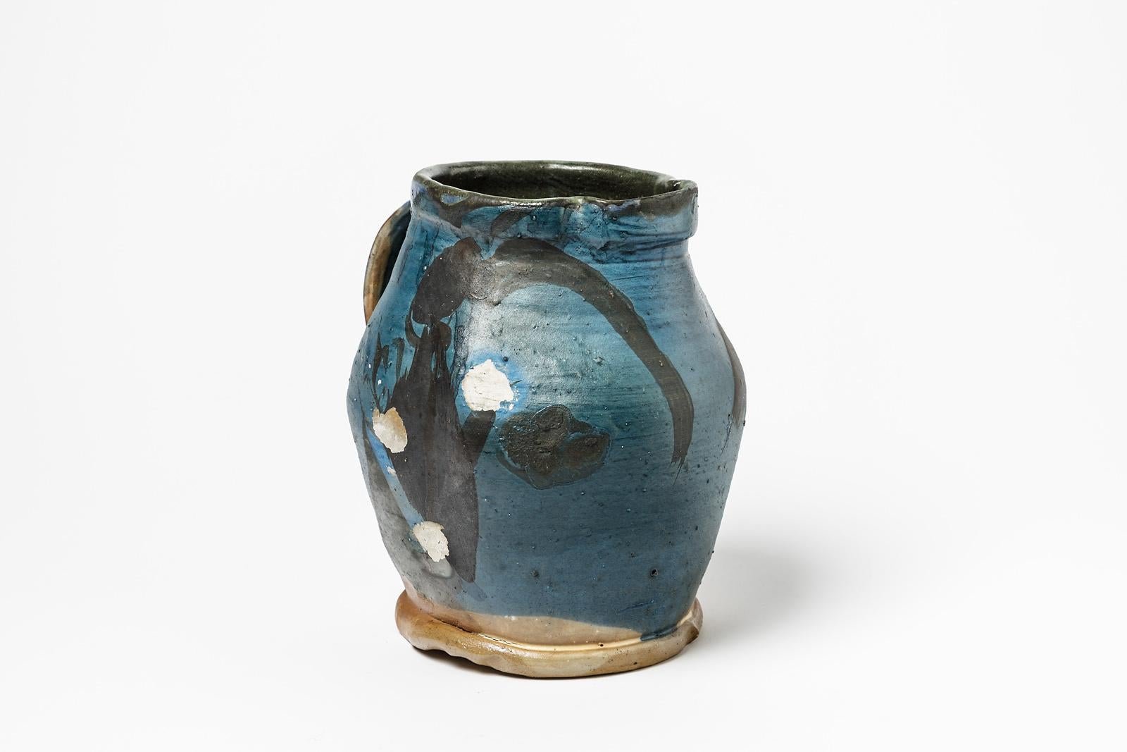 Michel lanos

Original mid-century abstract ceramic pitcher or vase

Blue and black ceramic glaze decoration

Original perfect condition

Measures: Height: 21cm, large: 18cm.