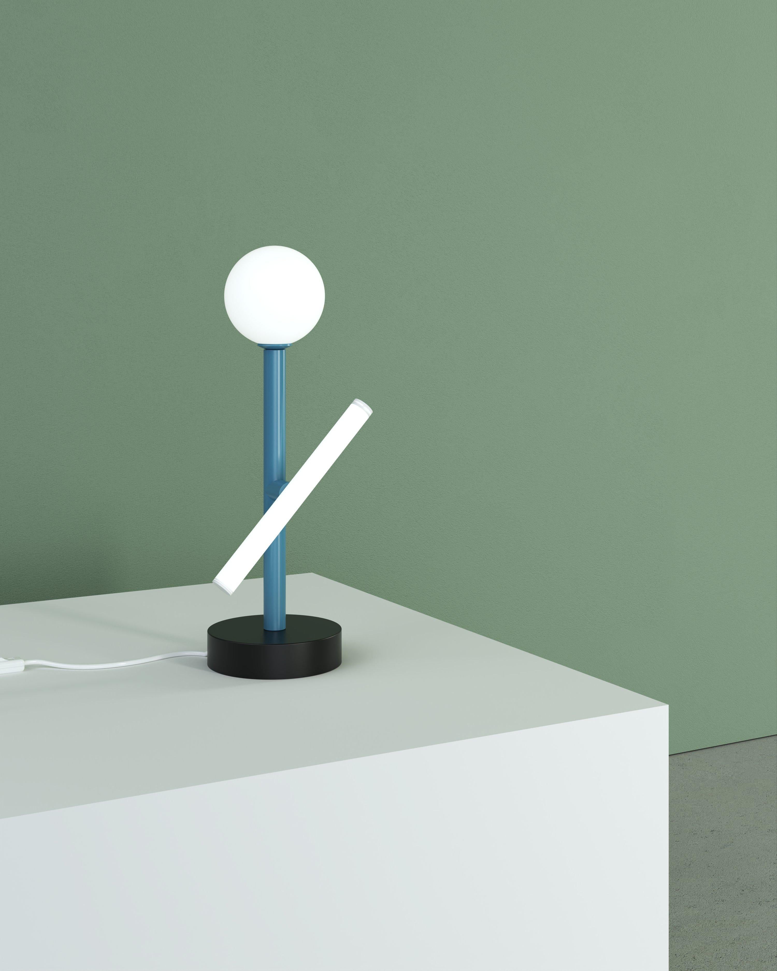 Blue and Black Tube and Globe Desk Light by Atelier Areti
Dimensions: D 12 x H 37 cm.
Materials: Powder-coated metal.

Available in other colors. Please contact us.

All our lamps can be wired according to each country. If sold to the USA it will be