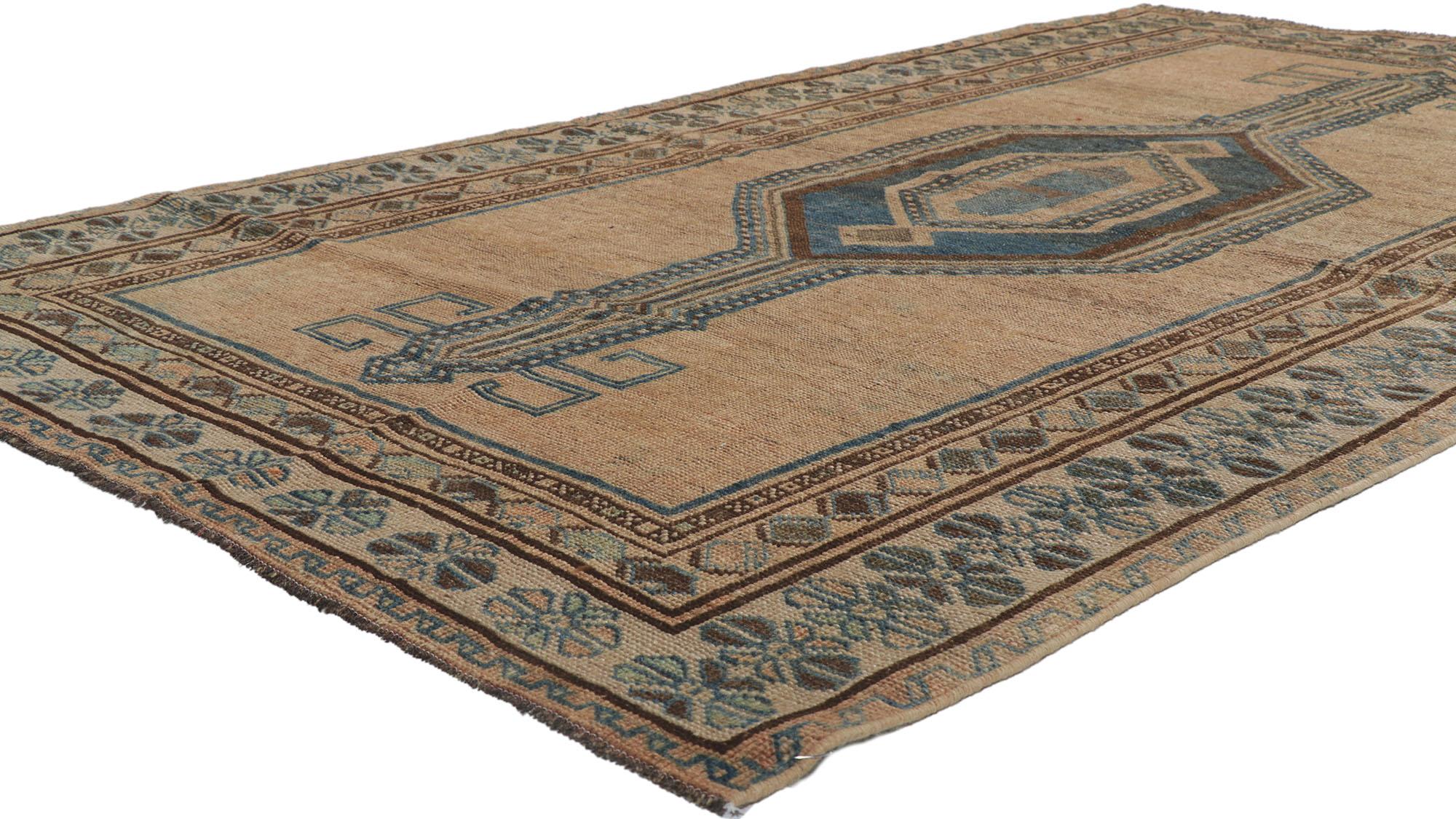 60988 blue and brown antique northwest Persian rug runner 04'11 x 08'06. Warm and inviting, this hand knotted wool antique Northwest Persian rug runner features a distinctive pole medallion design in an open abrashed brown field. Imbued with blue
