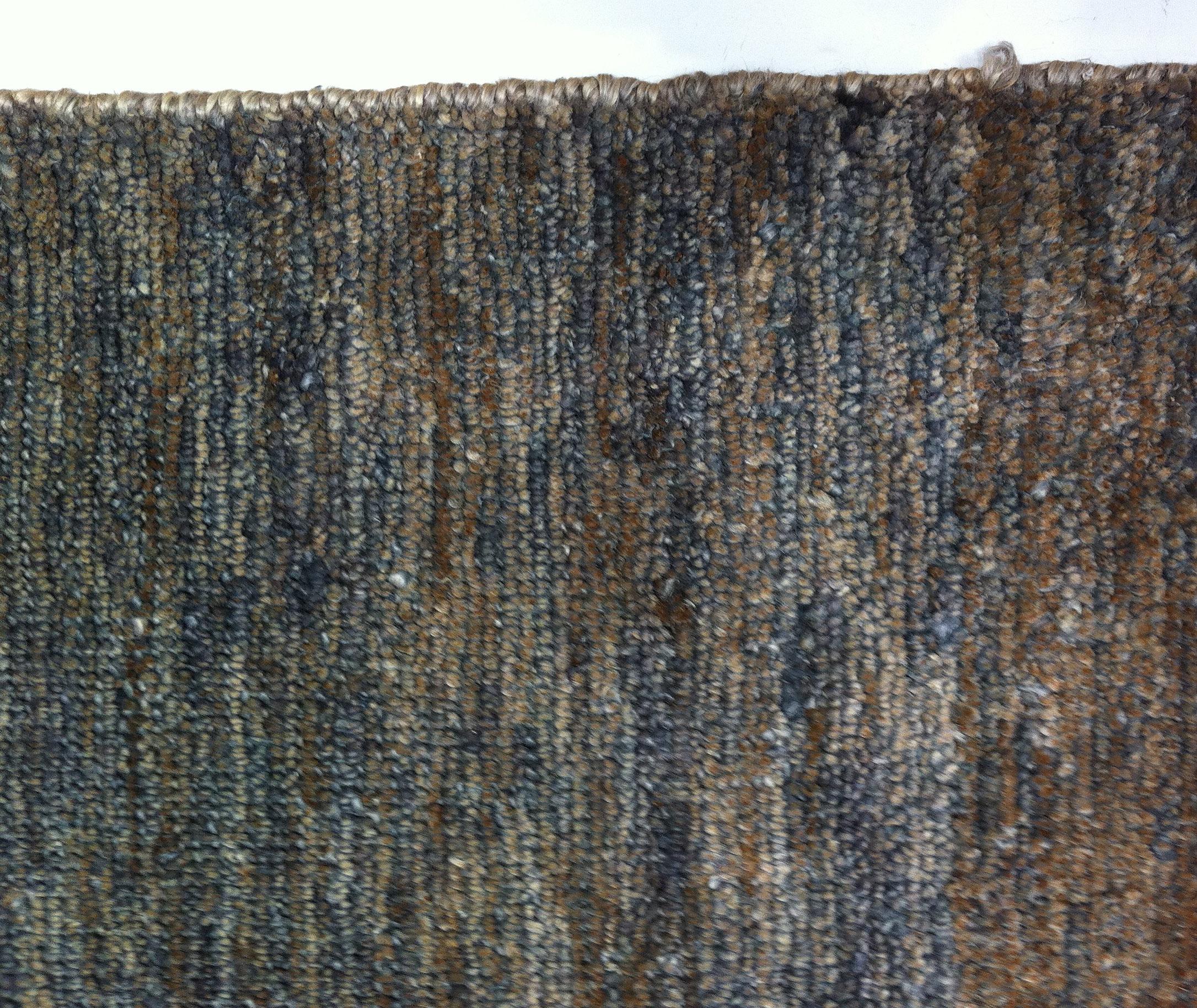 A wonderfully soft jute rug in the colors of well-worn denim and leather. A contemporary rug for the rustic cabin or urban space that features natural finishes. Best suited for low to medium traffic areas. 

Handmade in India using natural vegetal