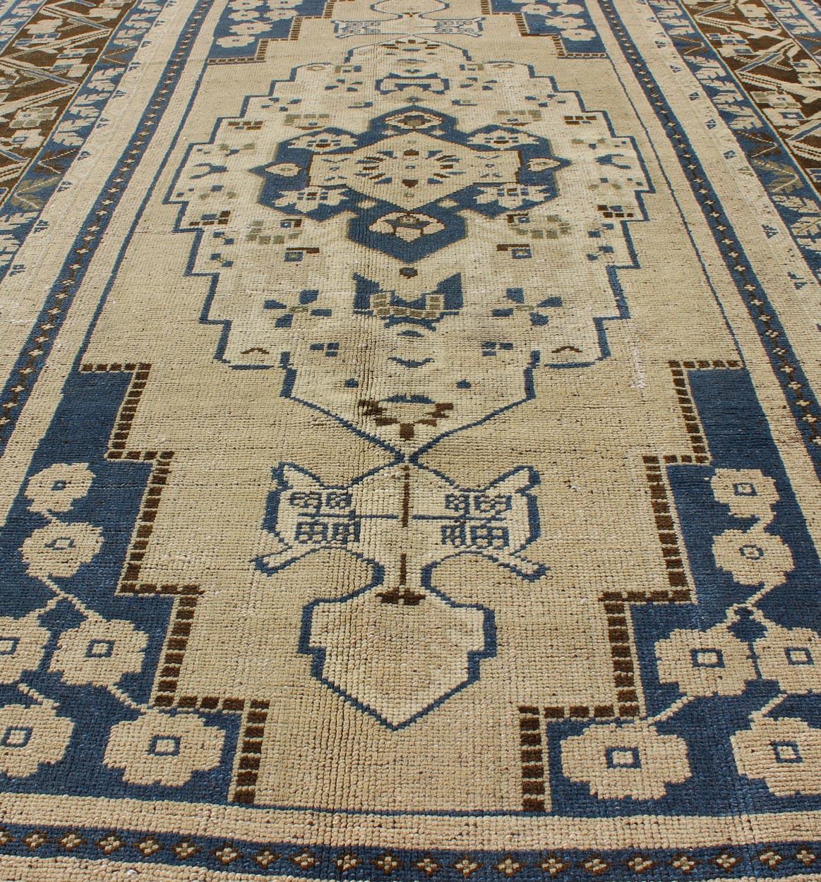 Blue and Brown Oushak Vintage Rug from Turkey with Geometric Layered Medallion In Good Condition For Sale In Atlanta, GA
