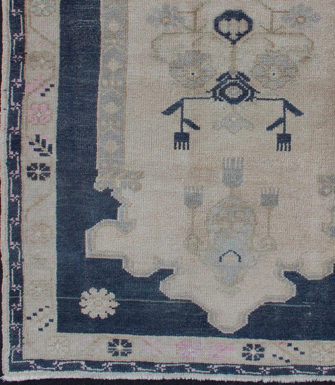 Hand-Knotted Blue and Cream Medallion Vintage Turkish Oushak Rug with Tribal Geometric Design For Sale