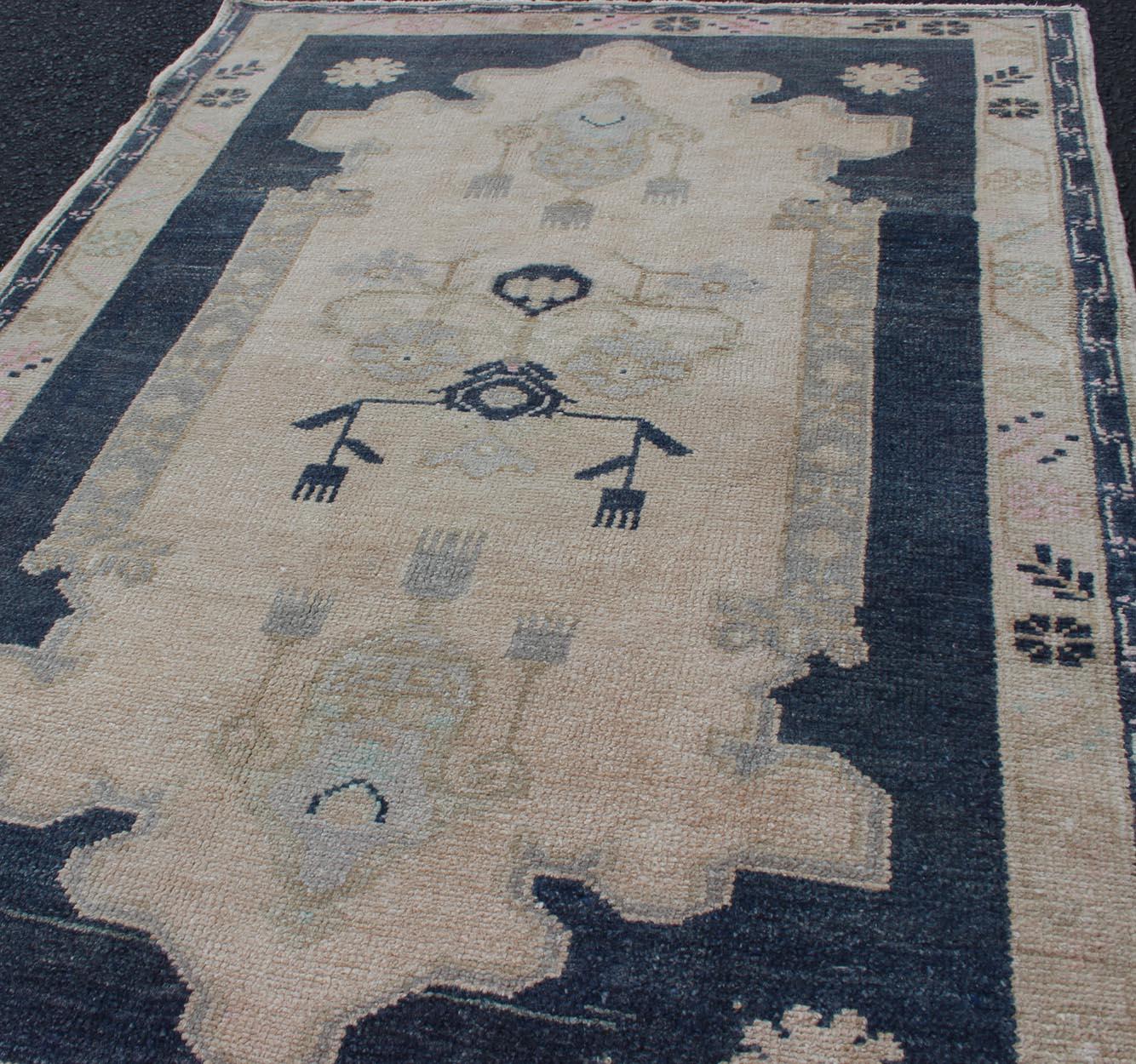 20th Century Blue and Cream Medallion Vintage Turkish Oushak Rug with Tribal Geometric Design For Sale