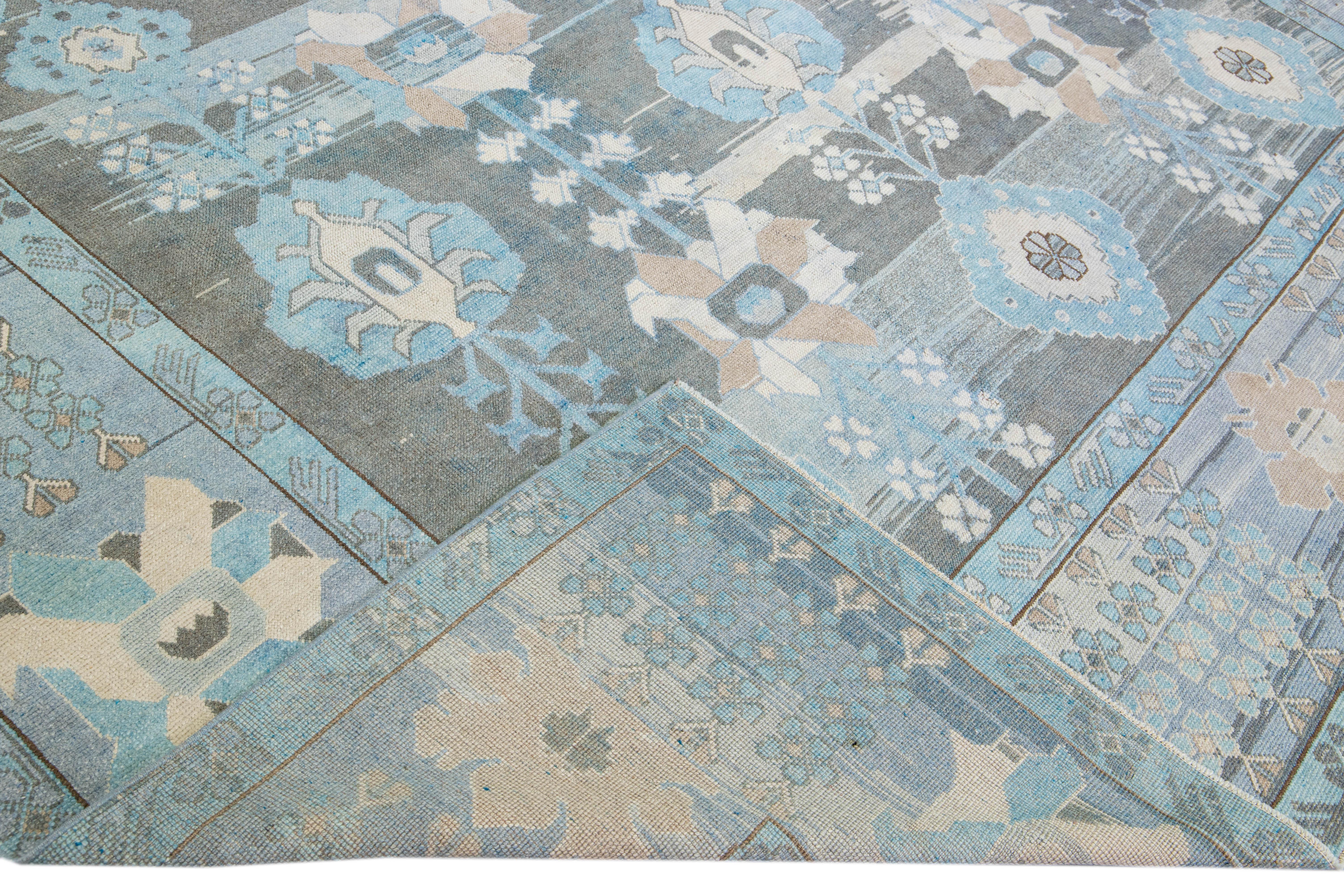 Beautiful contemporary Turkish Oushak hand-knotted rug with a blue-gray field. This Oushak rug has a tan accent in an all-over geometric floral design. 

This rug measures 10' x 12'3