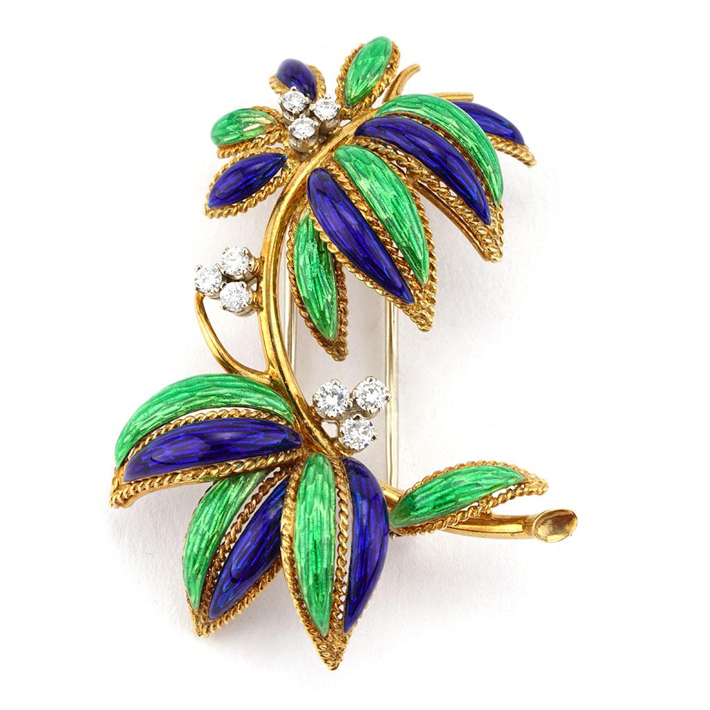 This tree motif pin weighs 15.20 DWT (approx. 23.64 grams). It contains 9 round G color and VS clarity diamonds weighing 0.60 CTTW.