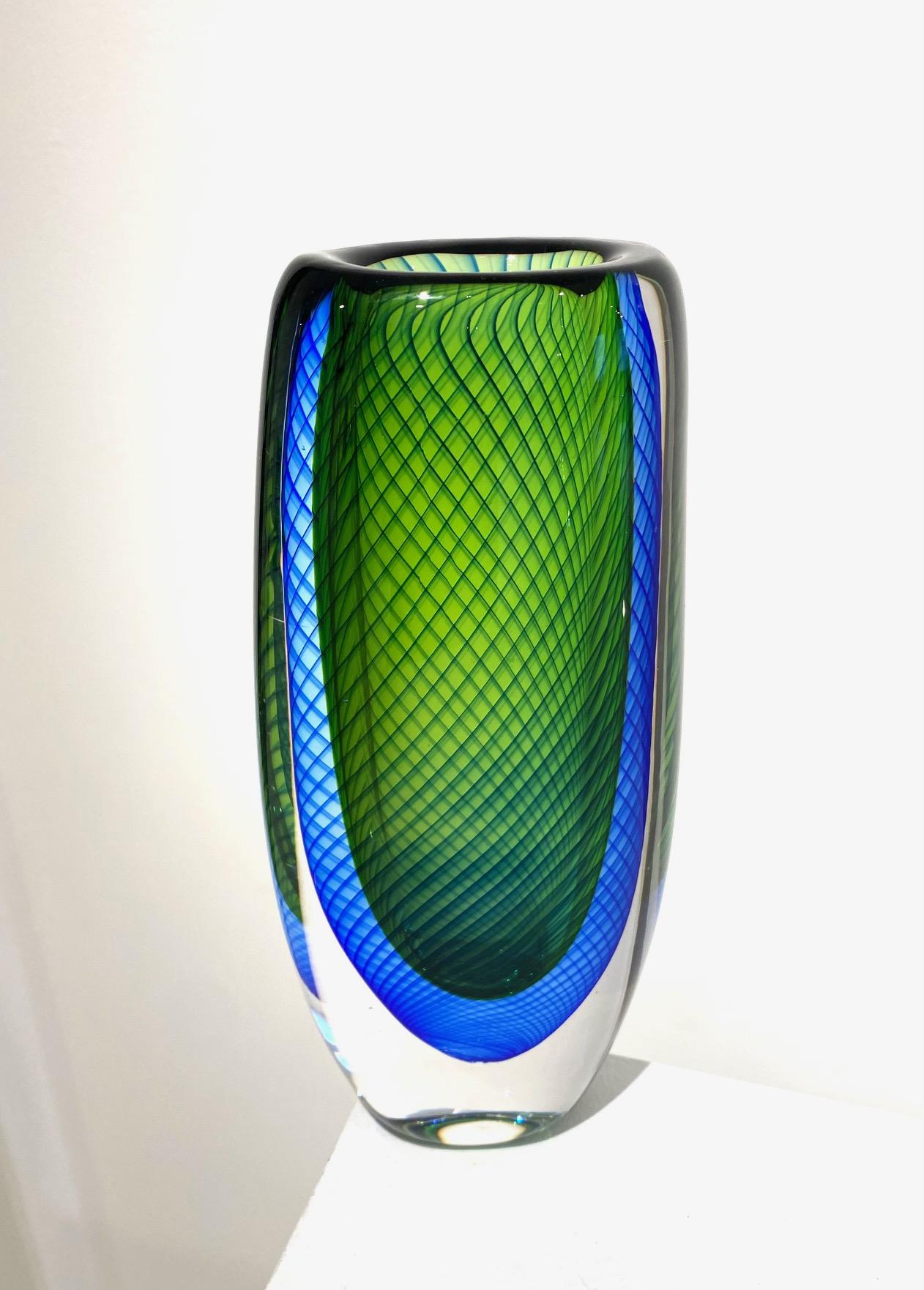 blue and green glass vase by Vicki Lindstrand for Kosta Boda. Etched signature and number to underside 'Kosta 441590'. Sweden: circa 1959 Lindstrand, who had begun his career as an illustrator before moving into glass, was first employed by Orrefors
