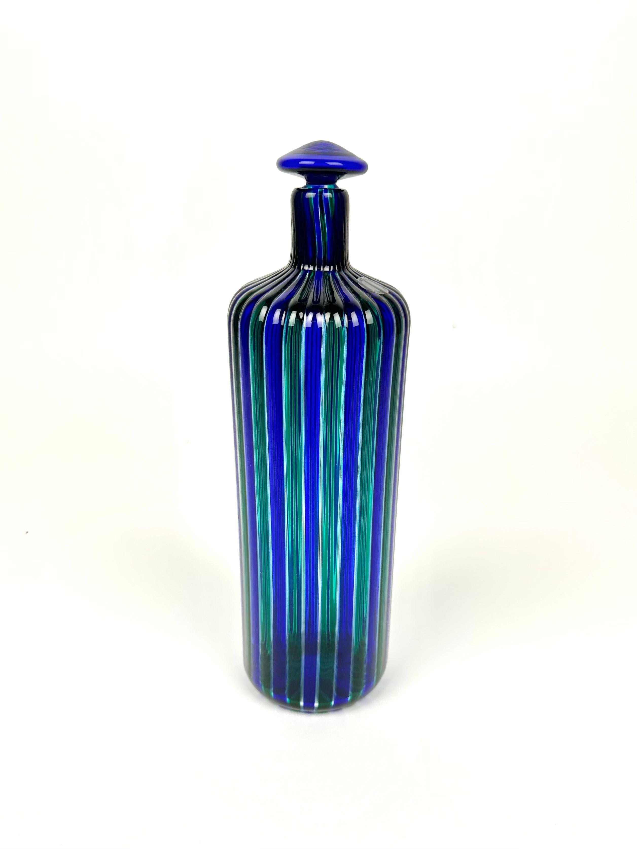 Astonishing blue and green Murano glass bottle by Fulvio Bianconi for Venini.

Signed “Venini88” on the bottom, as shown in the pictures. 

Made in Italy in 1988.