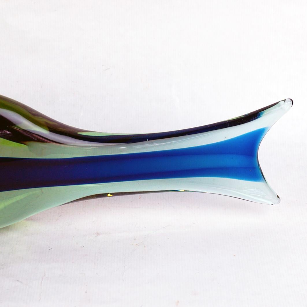 This large light green and blue hand blown glass fish was created by Antonio Da Ros in the 1960s and manufactured by Vetreria Gino Cenedese, Murano, Italy. 1960s.
It features a light green body with  a blue sommerso stripe over its whole
