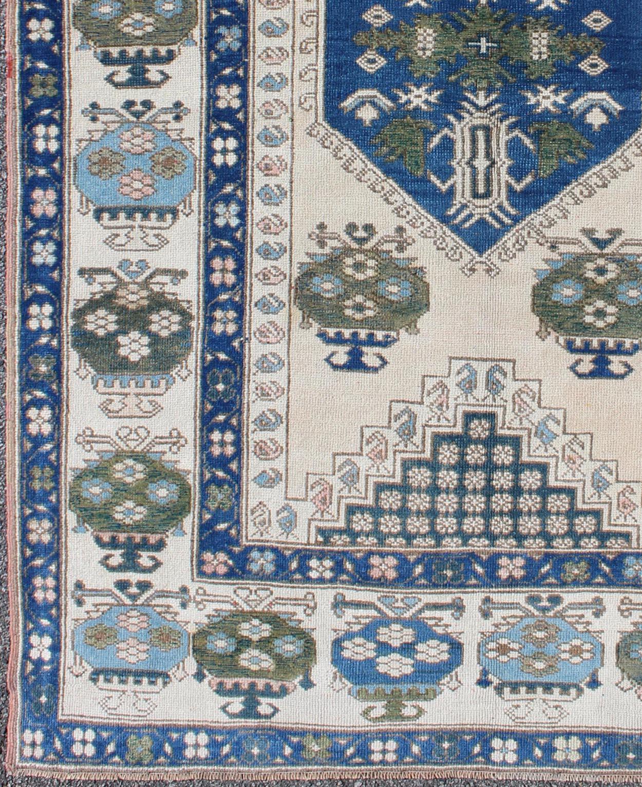 blue and green oushak rug