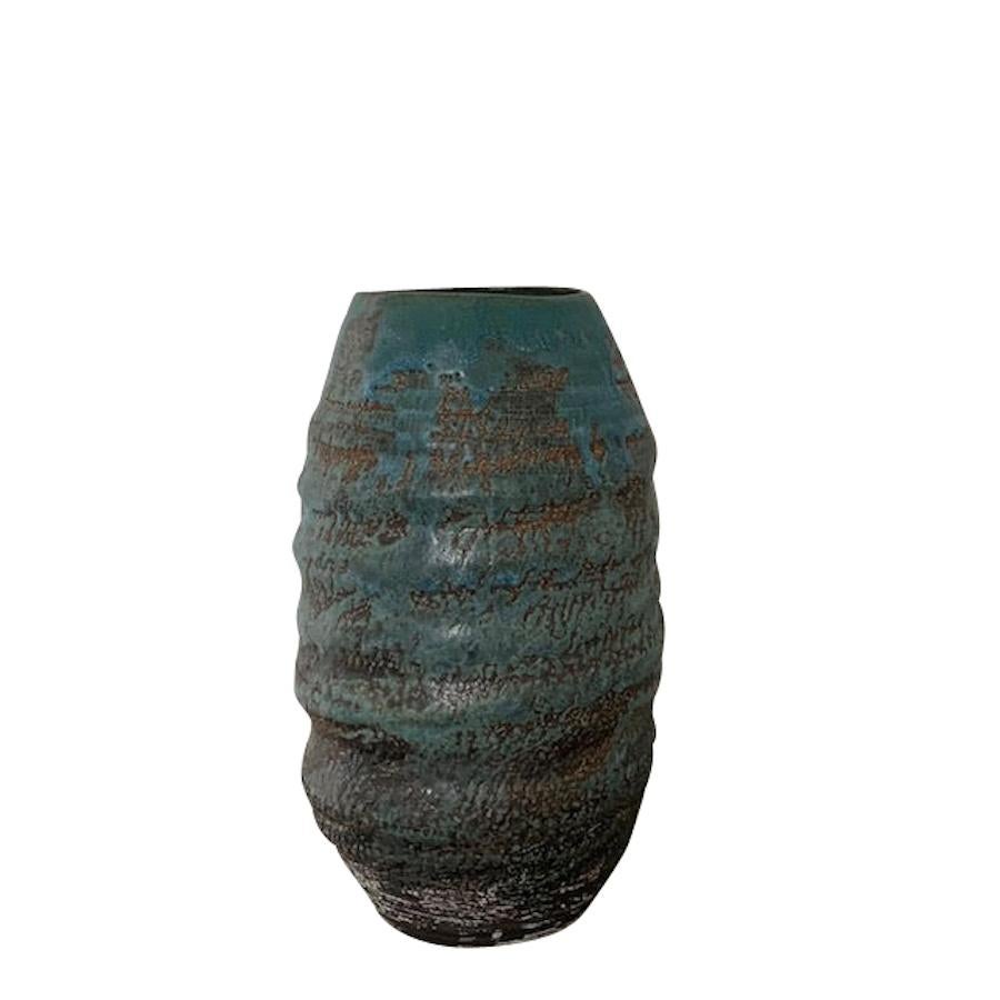 Contemporary American hand thrown vase by ceramic artist Peter Speliopoulos. 
One of many pieces from a series of work in a new collection.
Signed by the artist.
The matte blue glaze, paired with an agate glaze, react to create pieces with a