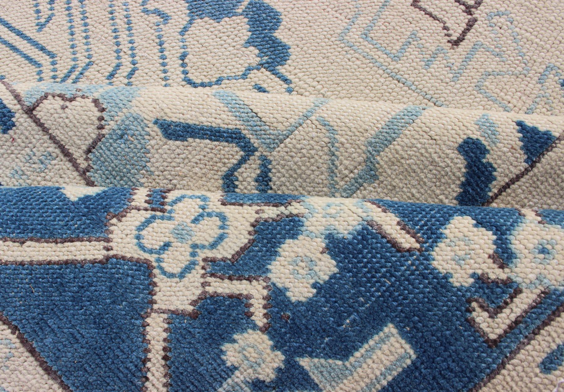 Blue and Ivory Geometric Design Vintage Turkish Rug with Blossoming Medallion In Excellent Condition For Sale In Atlanta, GA