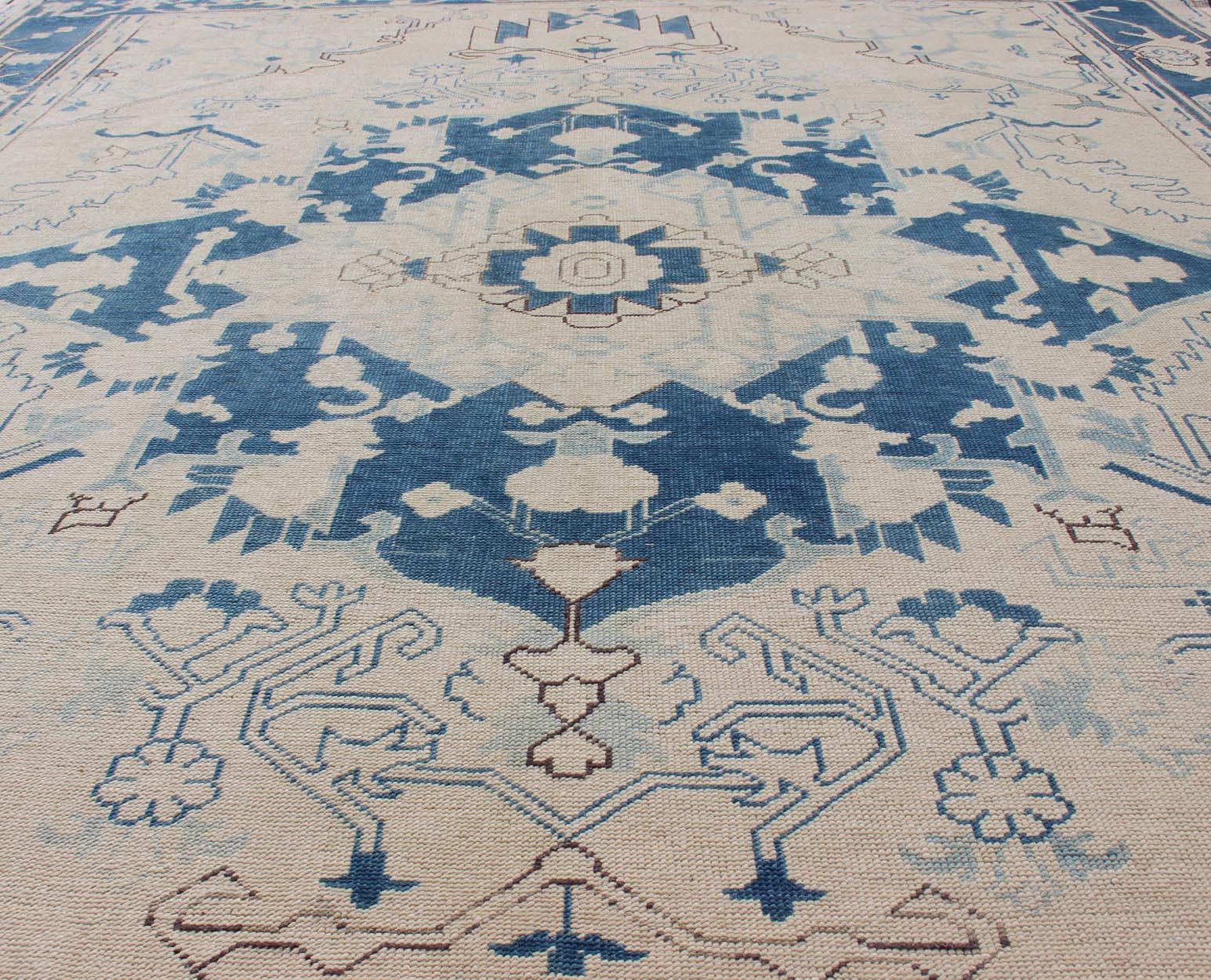 Mid-20th Century Blue and Ivory Geometric Design Vintage Turkish Rug with Blossoming Medallion For Sale