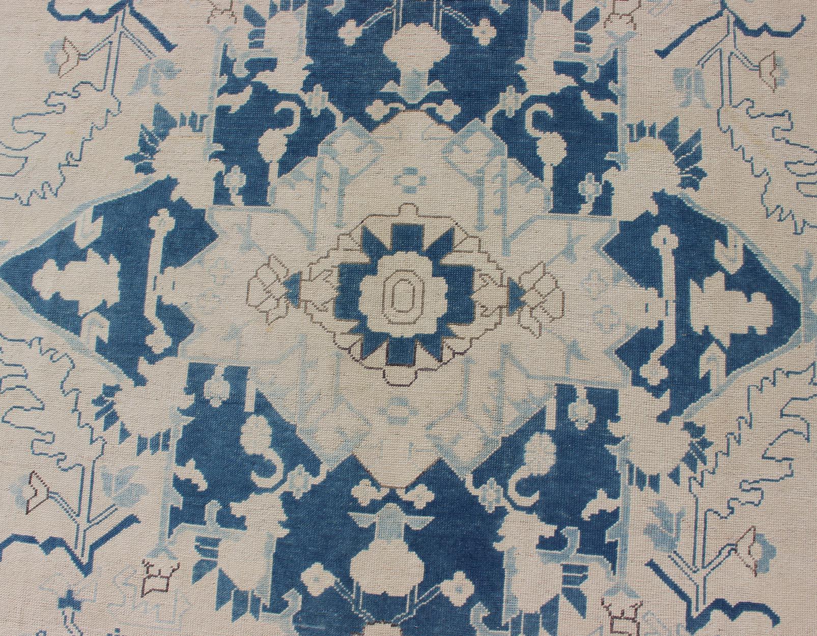Wool Blue and Ivory Geometric Design Vintage Turkish Rug with Blossoming Medallion For Sale