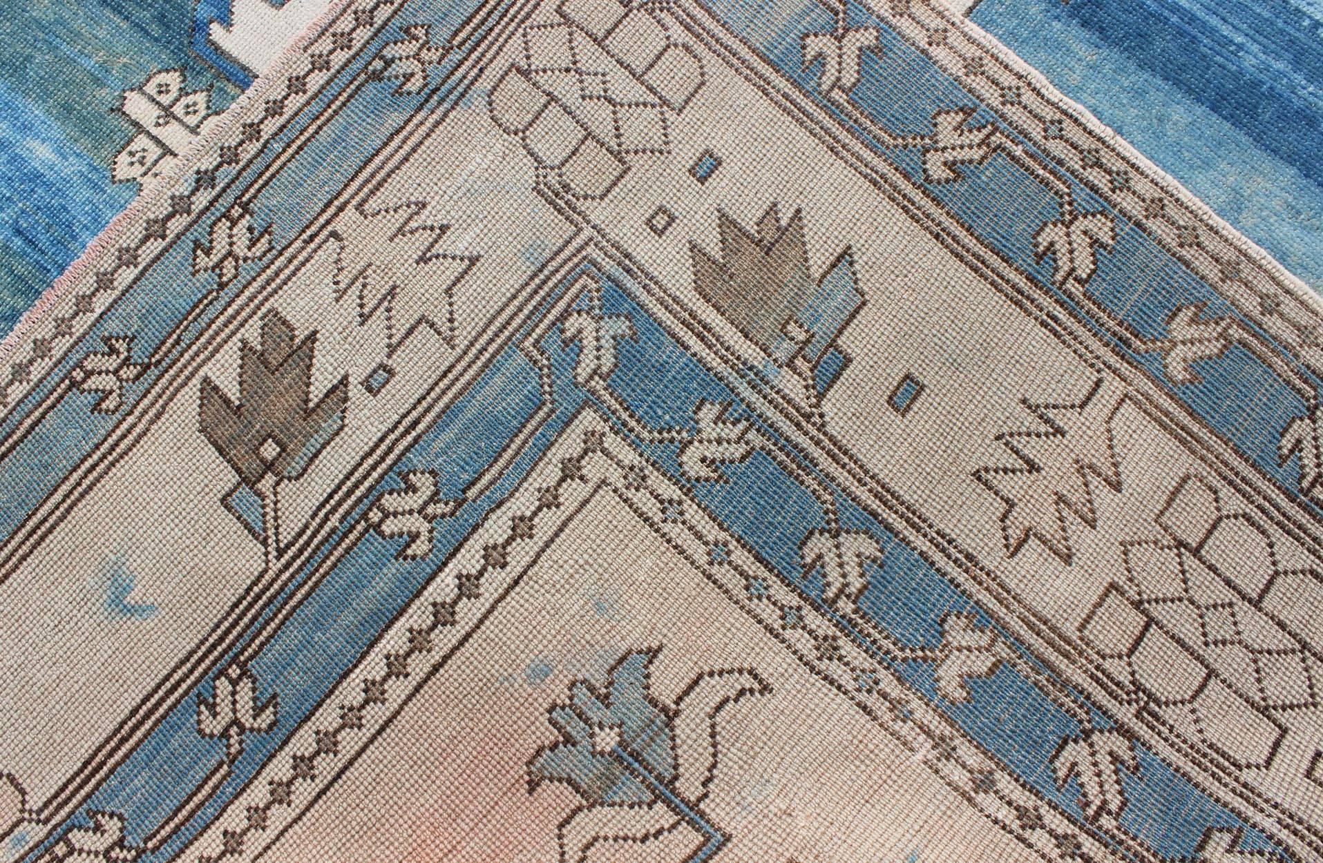 Mid-20th Century Blue and Ivory Medallion Vintage Turkish Oushak Rug with Tribal Geometric Design For Sale