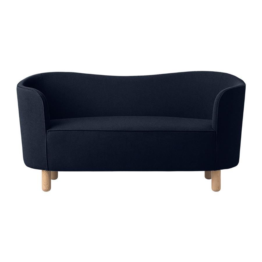 Blue and natural oak raf simons vidar 3 mingle sofa by Lassen.
Dimensions: W 154 x D 68 x H 74 cm. 
Materials: textile, oak.

The Mingle sofa was designed in 1935 by architect Flemming Lassen (1902-1984) and was presented at The Copenhagen