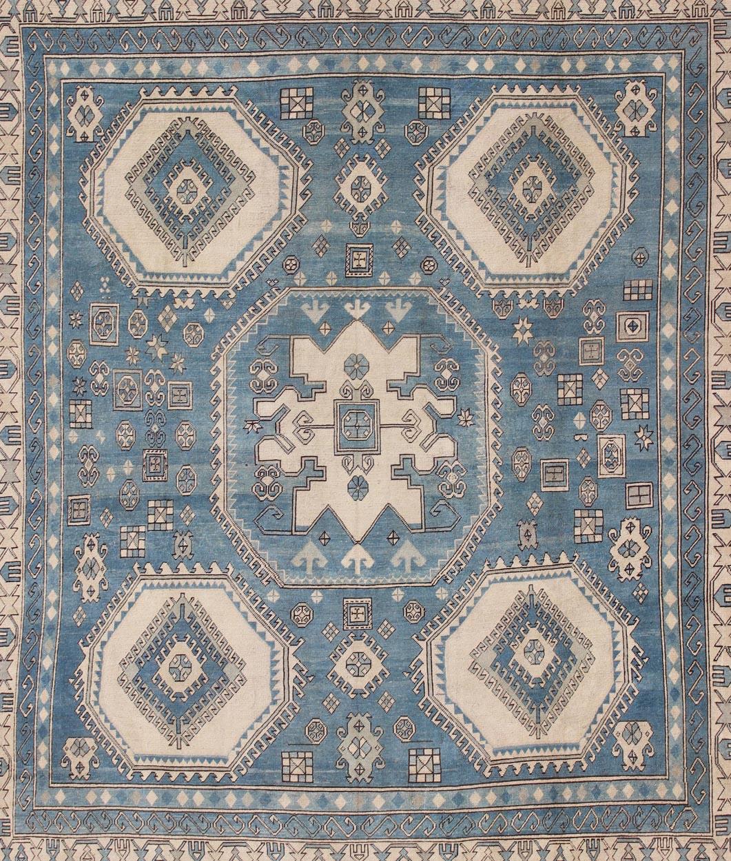 Hand-Knotted Blue and Cream Vintage Turkish Oushak Rug with Hooked Medallion Design For Sale
