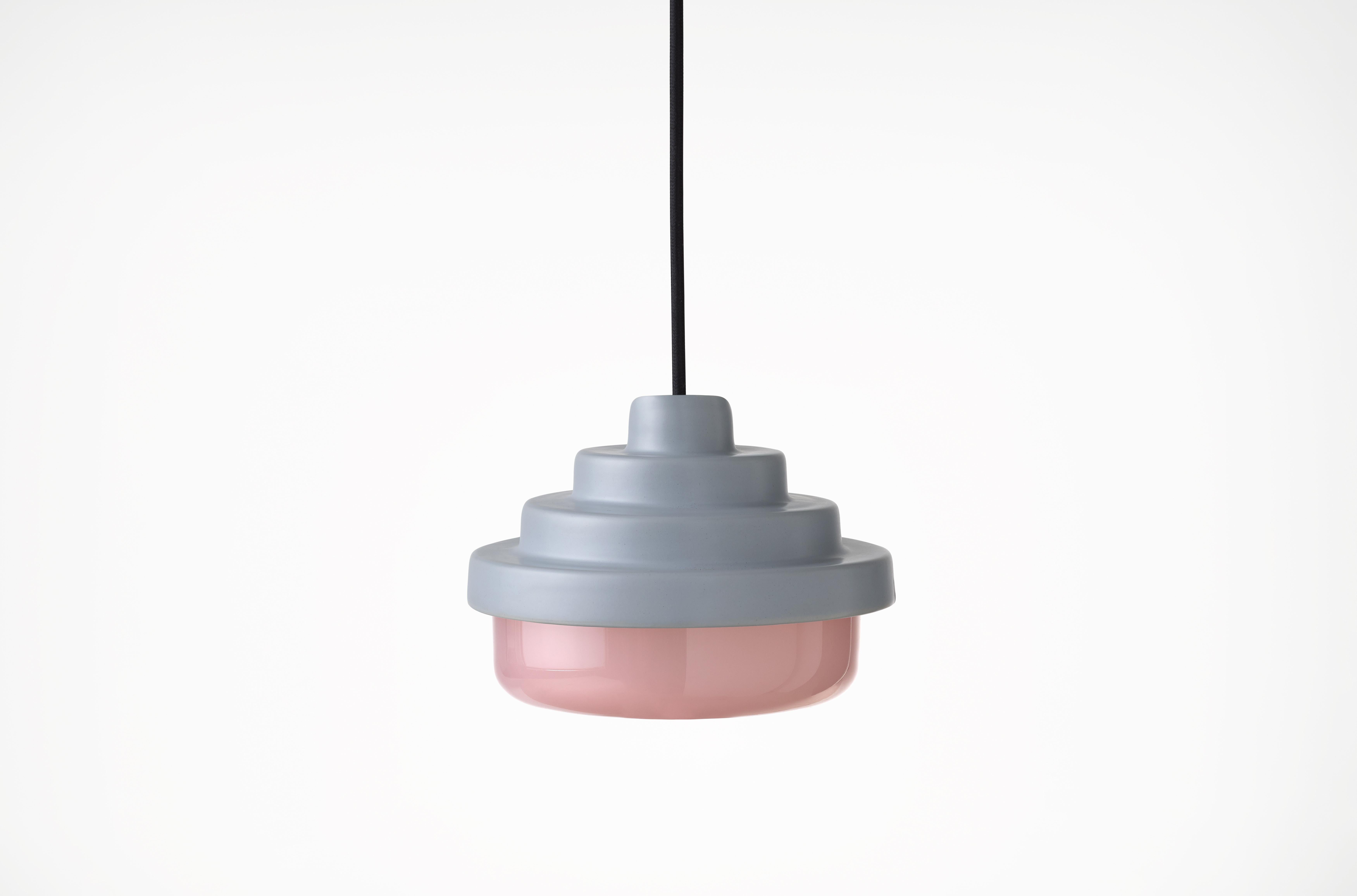 Blue and Pink Honey Pendant Light by Coco Flip
Dimensions: D 18 x W 18 x H 13 cm
Materials: Slip cast ceramic stoneware with blown glass. 
Weight: Approx. 2kg
Glass finishes: Pink.
Ceramic finishes: Blue satin glaze. 

Standard fixtures included
1 x