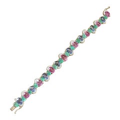 Blue and Pink Sapphire Bracelet Set In 18 Karat Gold with Emeralds and Diamonds