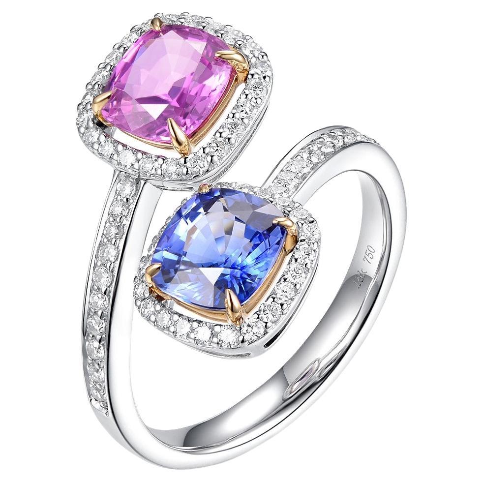 Introducing our stunning Toi et Moi ring, an exquisite piece of jewelry that perfectly embodies the timeless beauty of classic design. This ring features a dazzling 1.20 carat cushion-cut pink sapphire and a breathtaking 1.25 carat cushion-cut blue