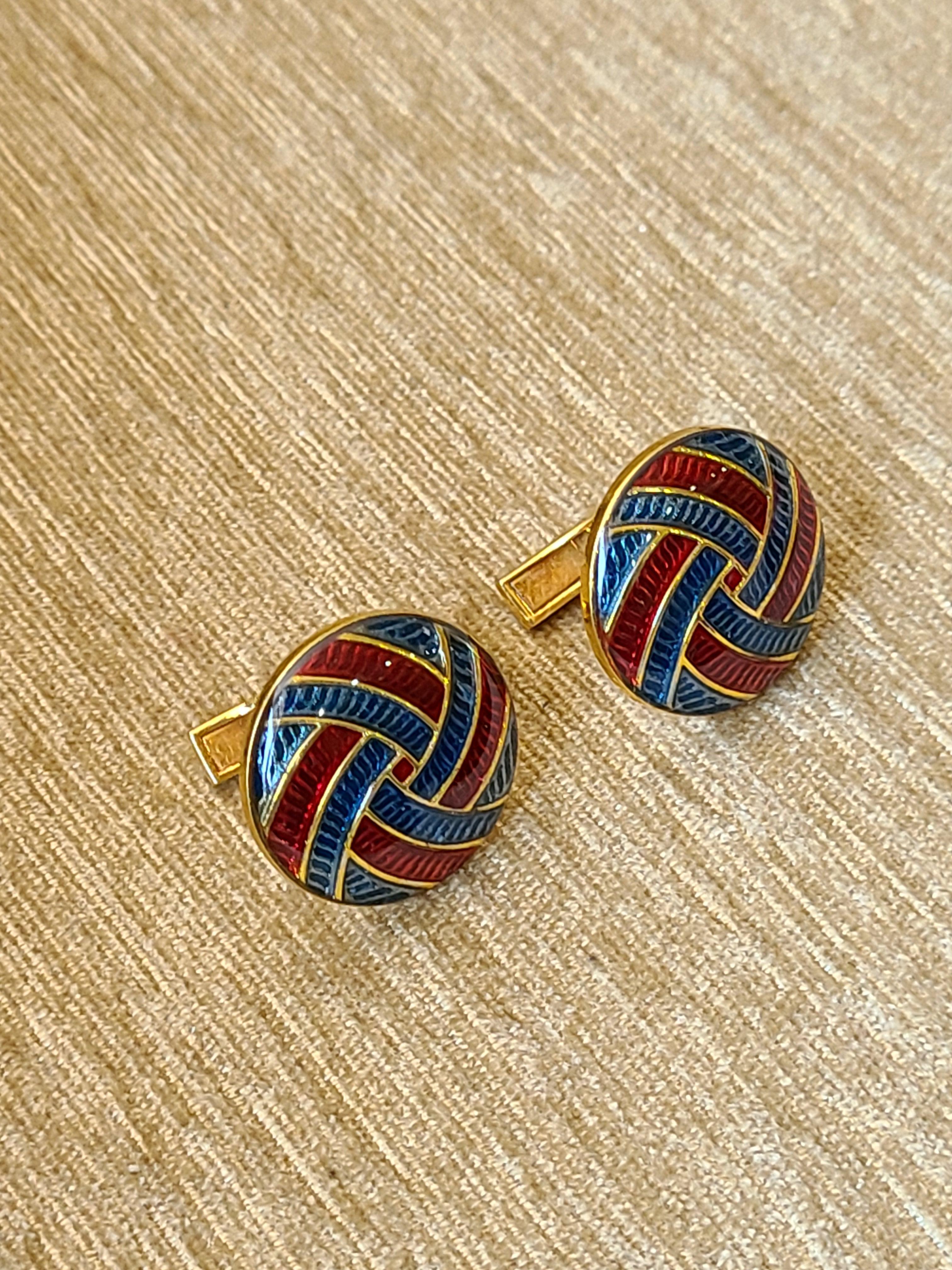 A unique set of cufflinks with blue and red enamel made in 14 k yellow gold. The enamel cufflinks net gold weight is 13.47 grams and dimensions in cm 2 x 2 x 1.7 (LXWXD).